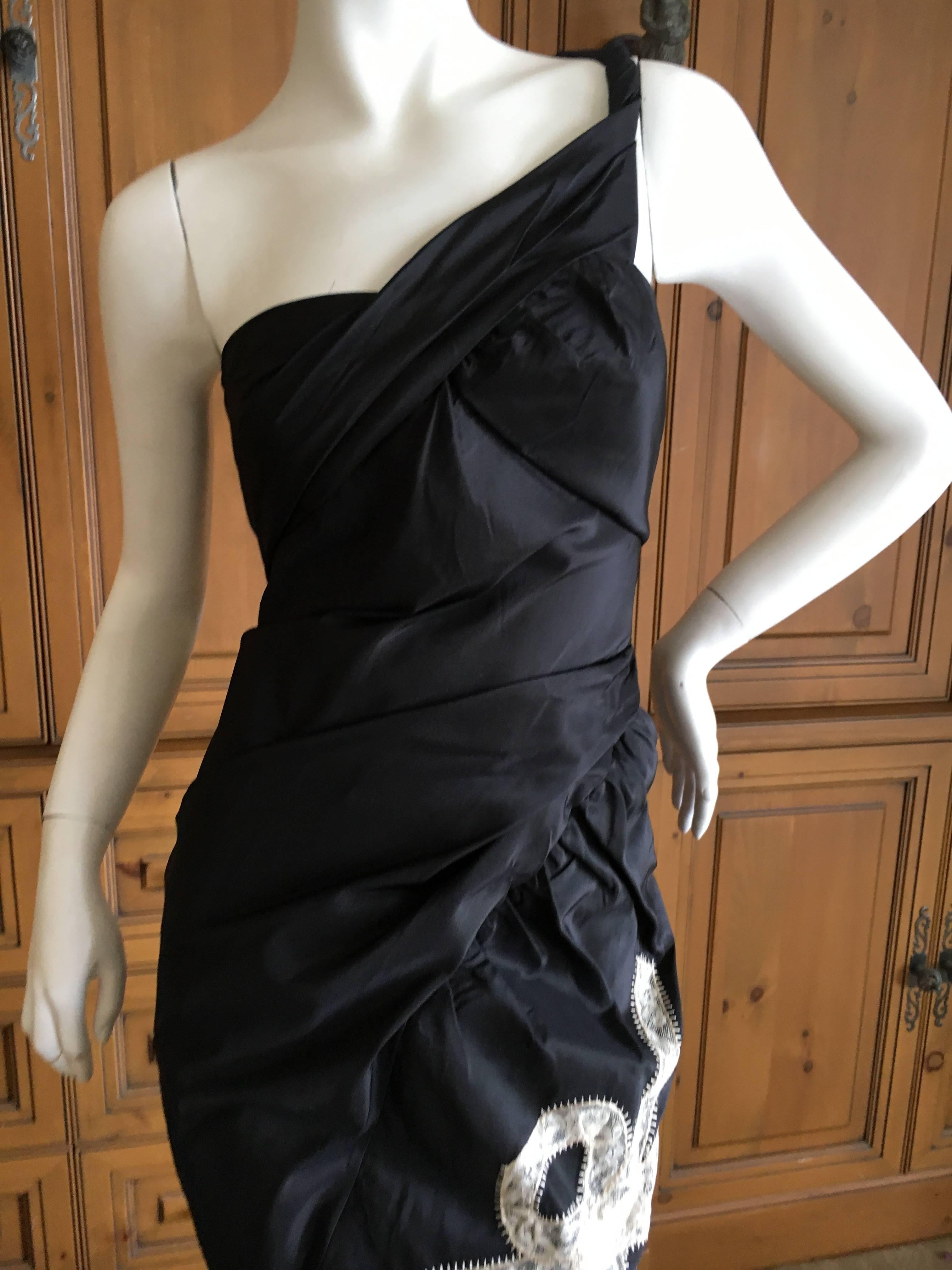 Magnificent evening gown in black taffeta from John Galliano.
There is a dramatic train and lace embellishments.
Bust 38