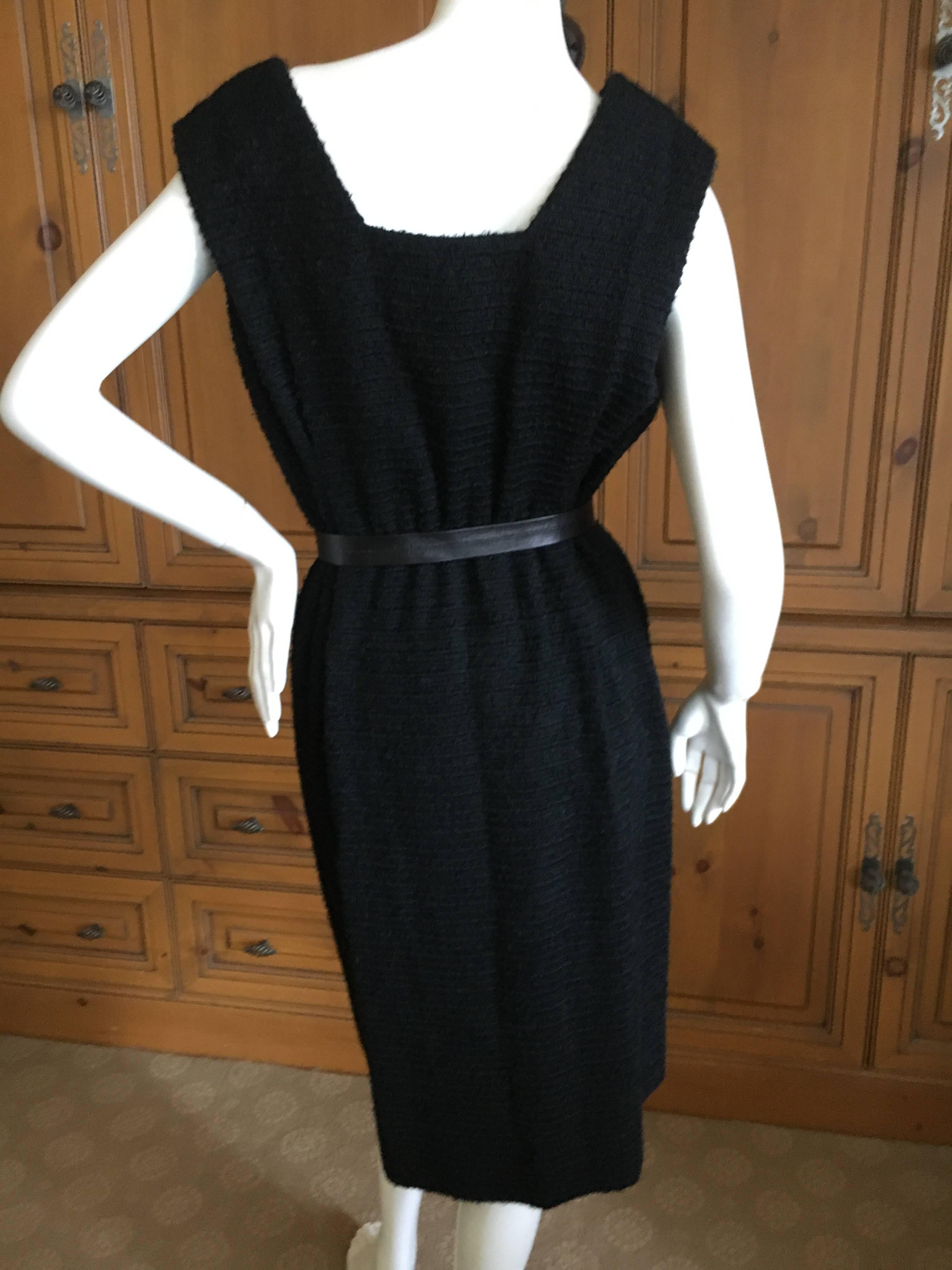 Galanos 1965 Little Black Dress with Leather Tie Belt.
Nubby wool with buttons down the front, lined in silk.
Bust 40"
Waist 26"
Hips 40"
Length 42"
Excellent Condition