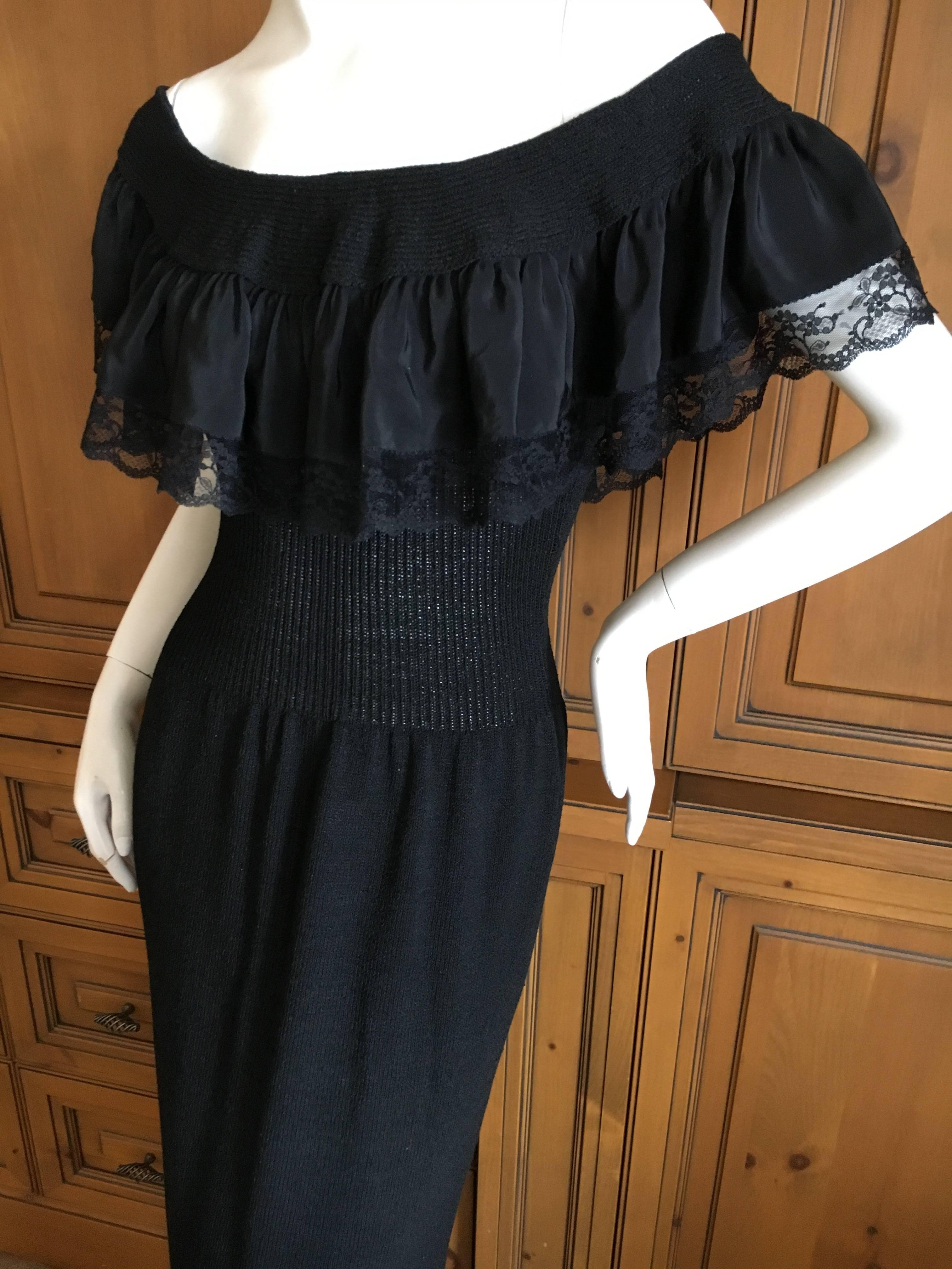 Adolfo Black Knit Off the Shoulder Ruffle Column Gown .
This is such a charming piece, knit  , it clings in all the right places.
Measurements given are not stretched.
Bust 34