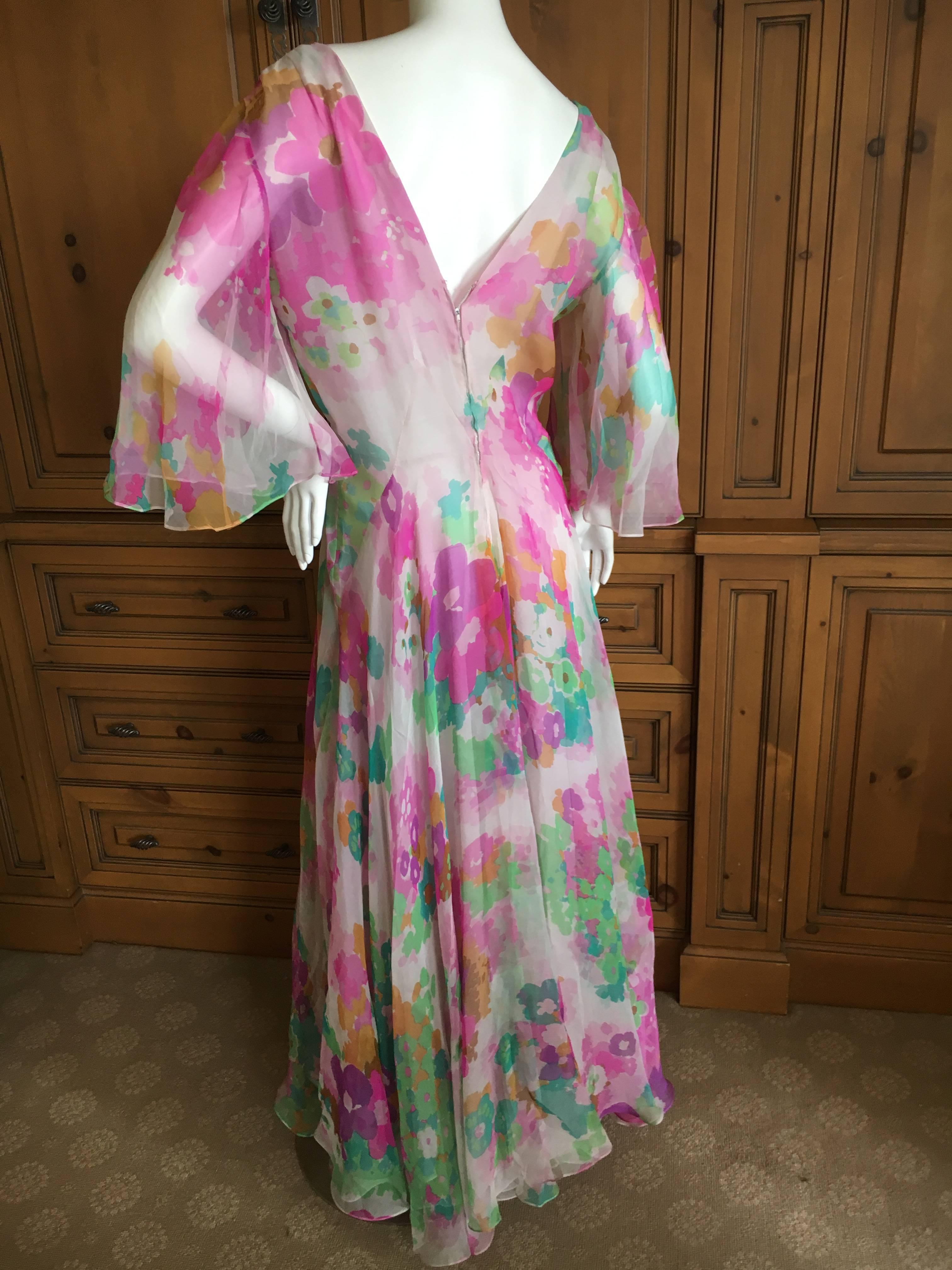 Romantic silk chiffon floral dress from Marc Bohan for Christian Dior.
Cut on the bias, with etherial bell sleeves, it flows beautifully when worn.
The label is numbered, it is demi haute couture.
Bust 40
