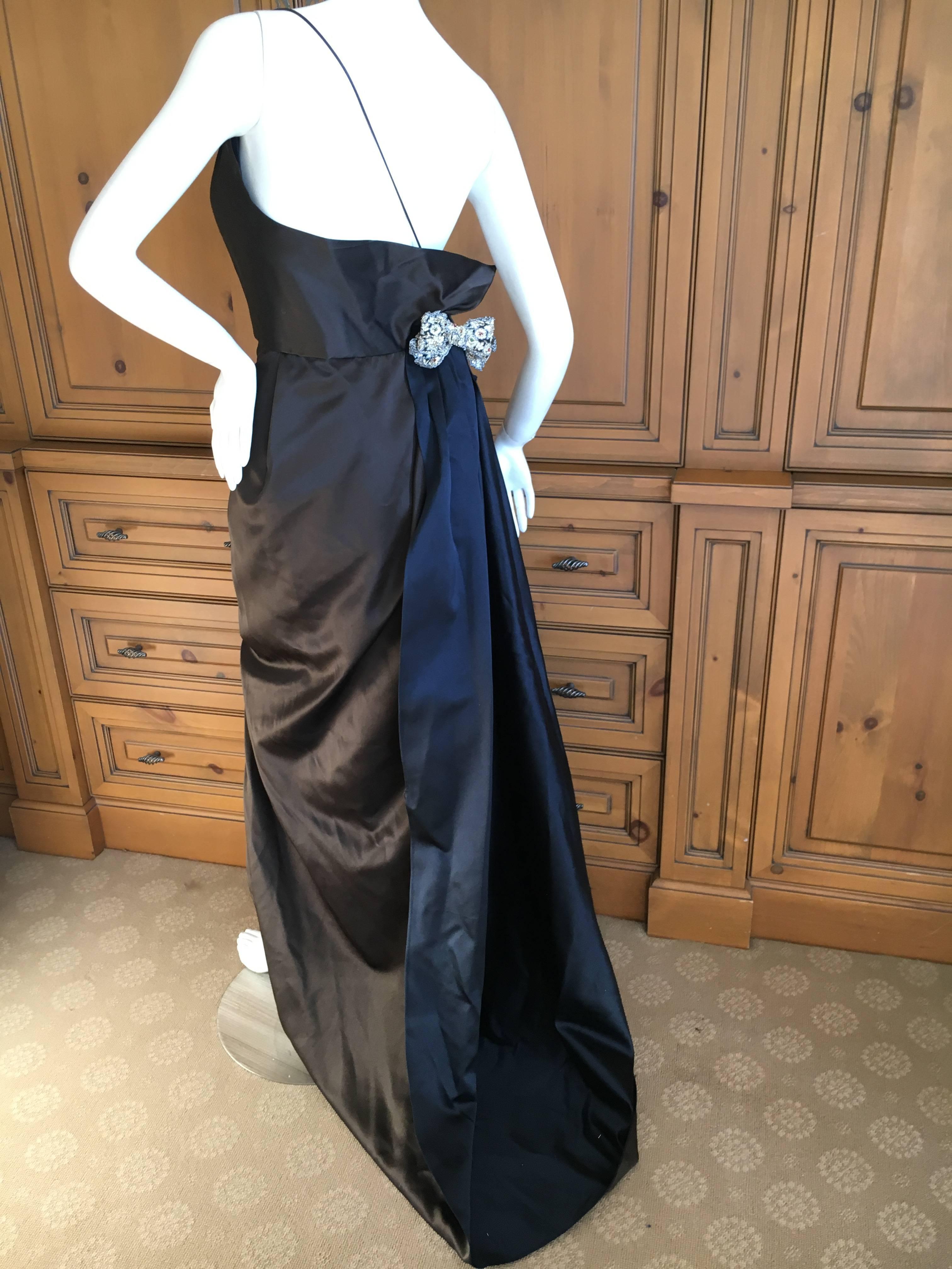 Exquisite sweeping brown silk evening dress with navy blue underside, and embellished bows on the hip and shoulder.

This is so pretty , the photos don't quite capture the charm.
Size 2
Bust 34"
Waist 24"
Hips 40"
Length