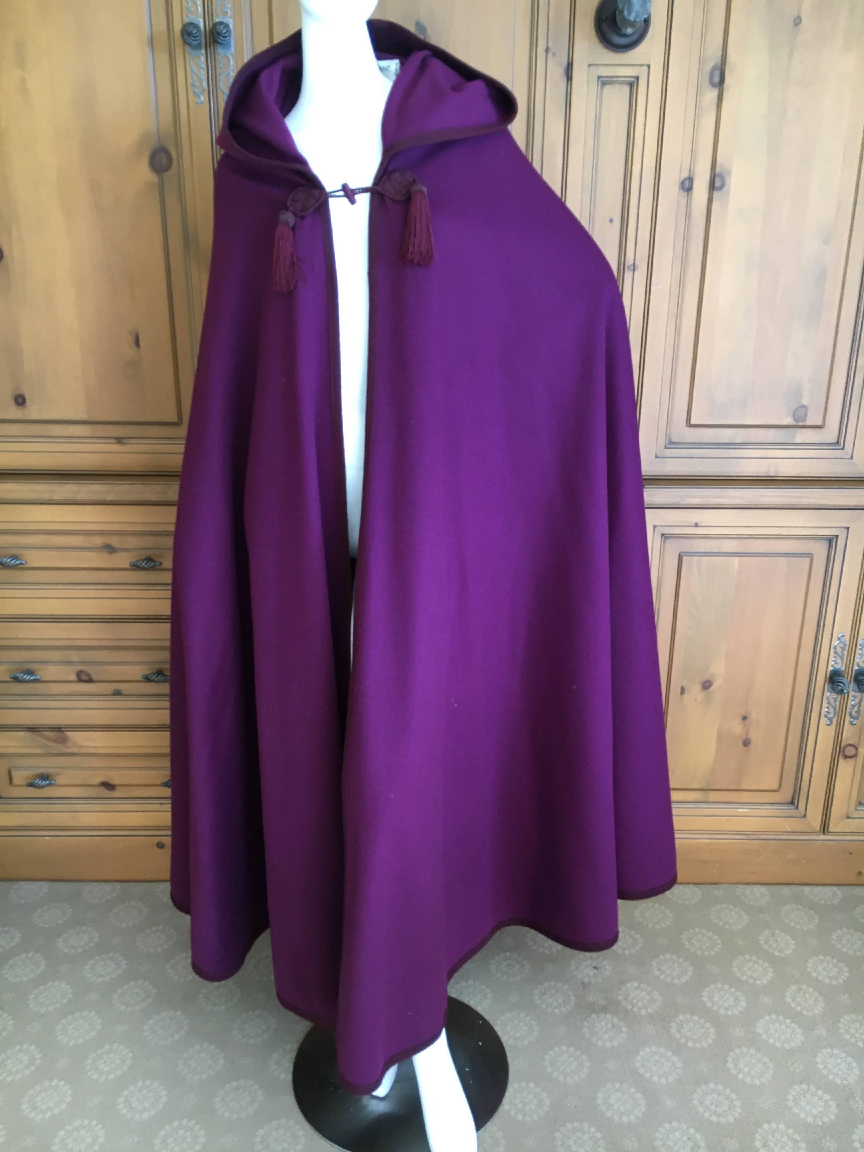 Yves Saint Laurent Rive Gauche Purple Cape with Hood and Tassels.
Of all the Capes YSL designed, this one is the best. WIth sutache and double tassels on the front, hooded with a long tassel down the back.
Rare to find in this color.
In excellent