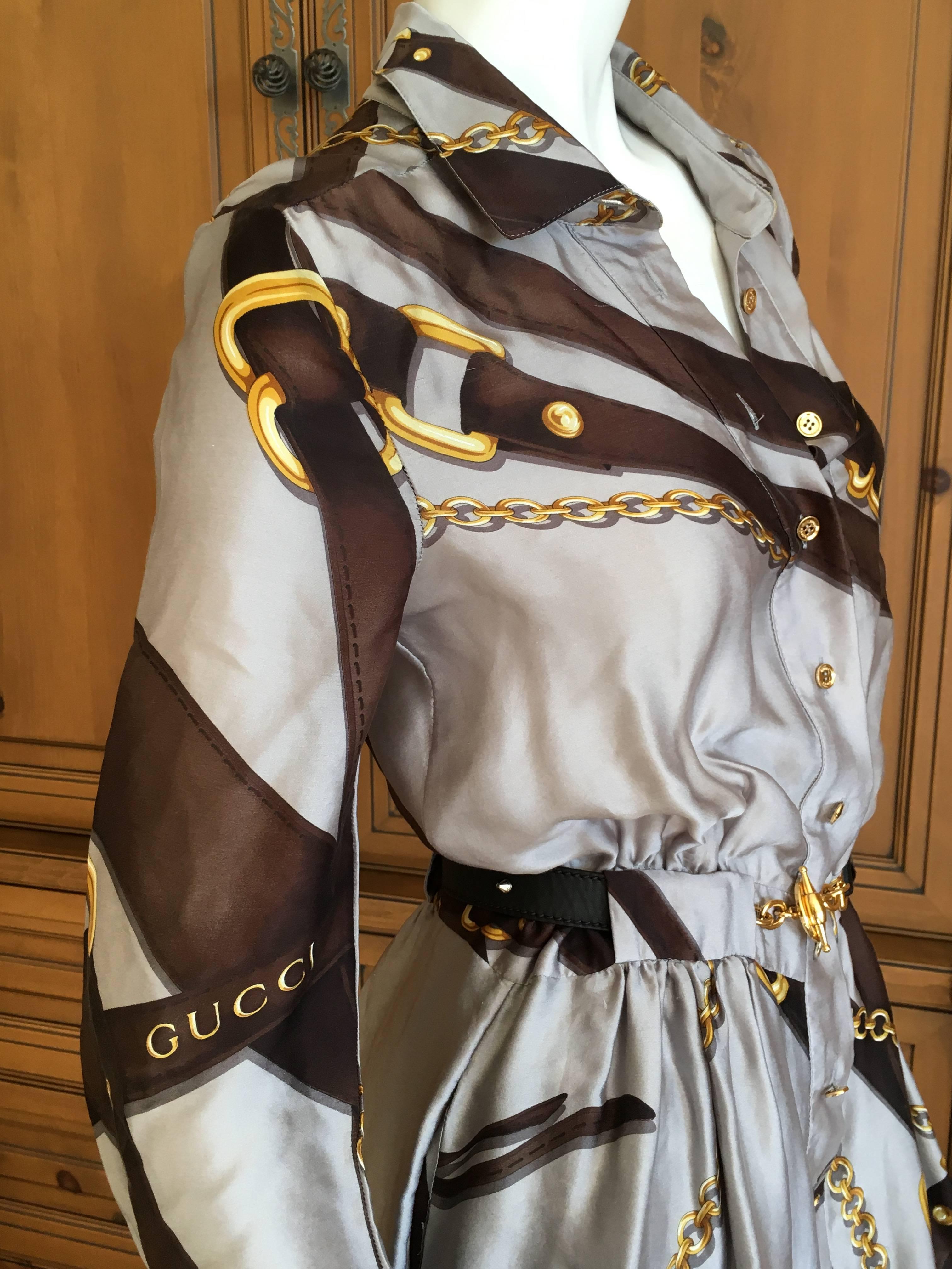 Gucci Silk Scarf Print Equestrian Theme Dress with Gold Chain Belt.
Bridal bit theme print button front shirt dress with a wonderful attached golden toggle belt.
From Fall 2011
Size 40
Bust 36
