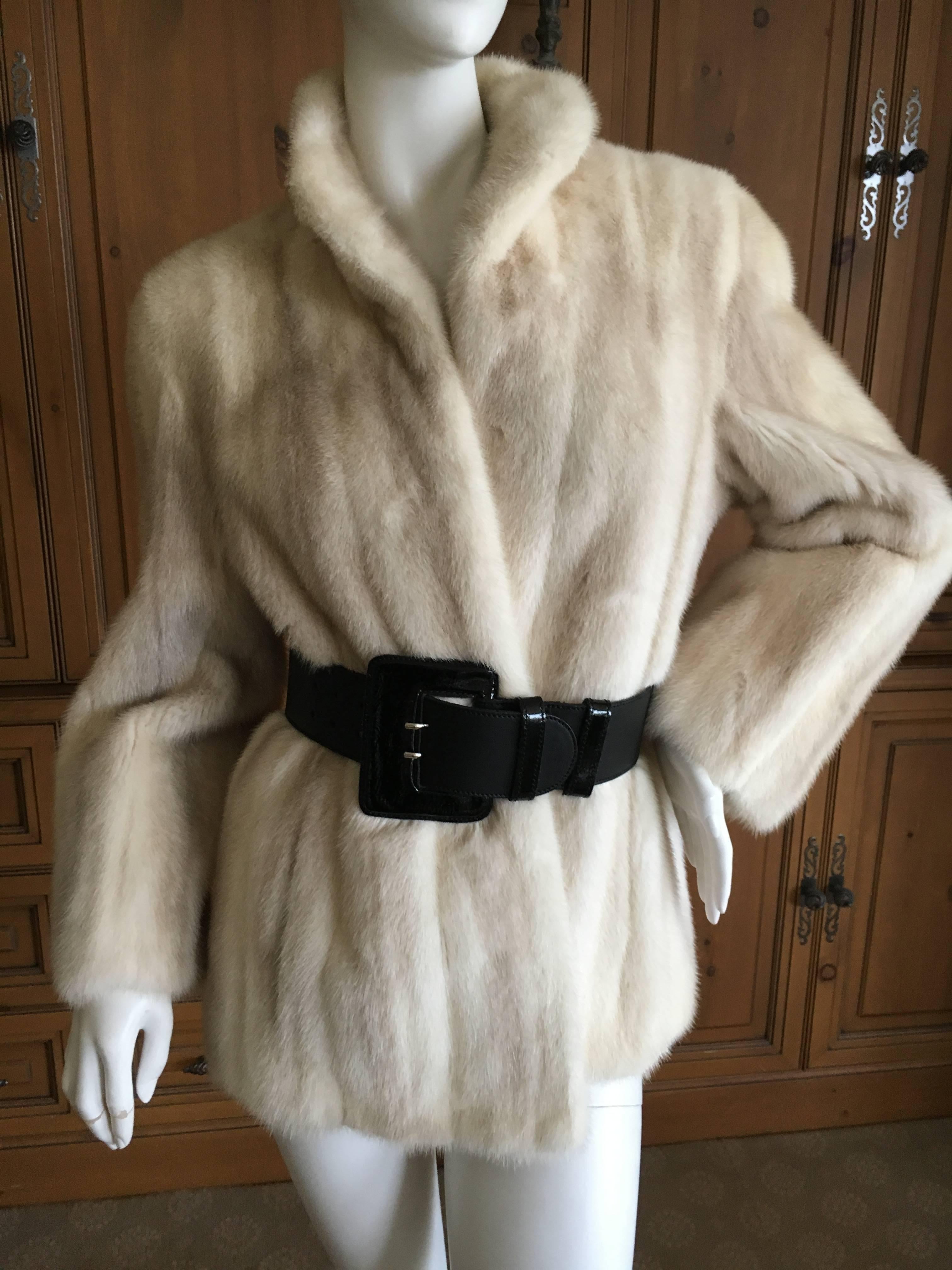 Luxurious female pelt natural pearl mink cropped jacket from
 Shumacher Furs , Portland Oregon.

Great pre owned Condition.
Belt for styling only, not included.
Bust 44"
Length 28"
Sleeve 21"
Sweep 46"
Comes with