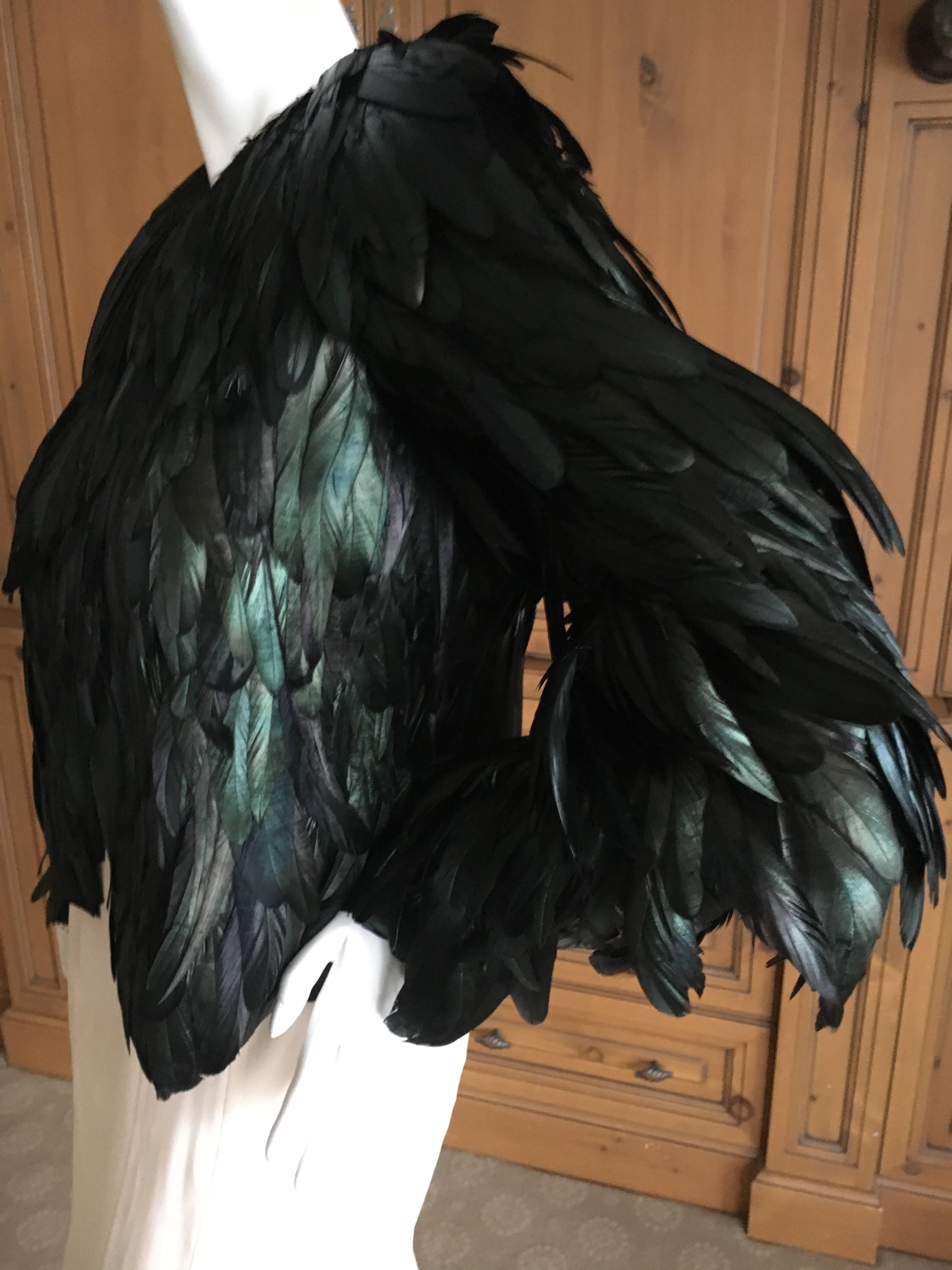 Amazing Coq feather jacket from Gucci
Fall 2012
Size 42, 
Seems to run small, especially the cuff of the sleeves, which are very tiny.
It has very long sleeves with small cuff openings.

 Bust 40