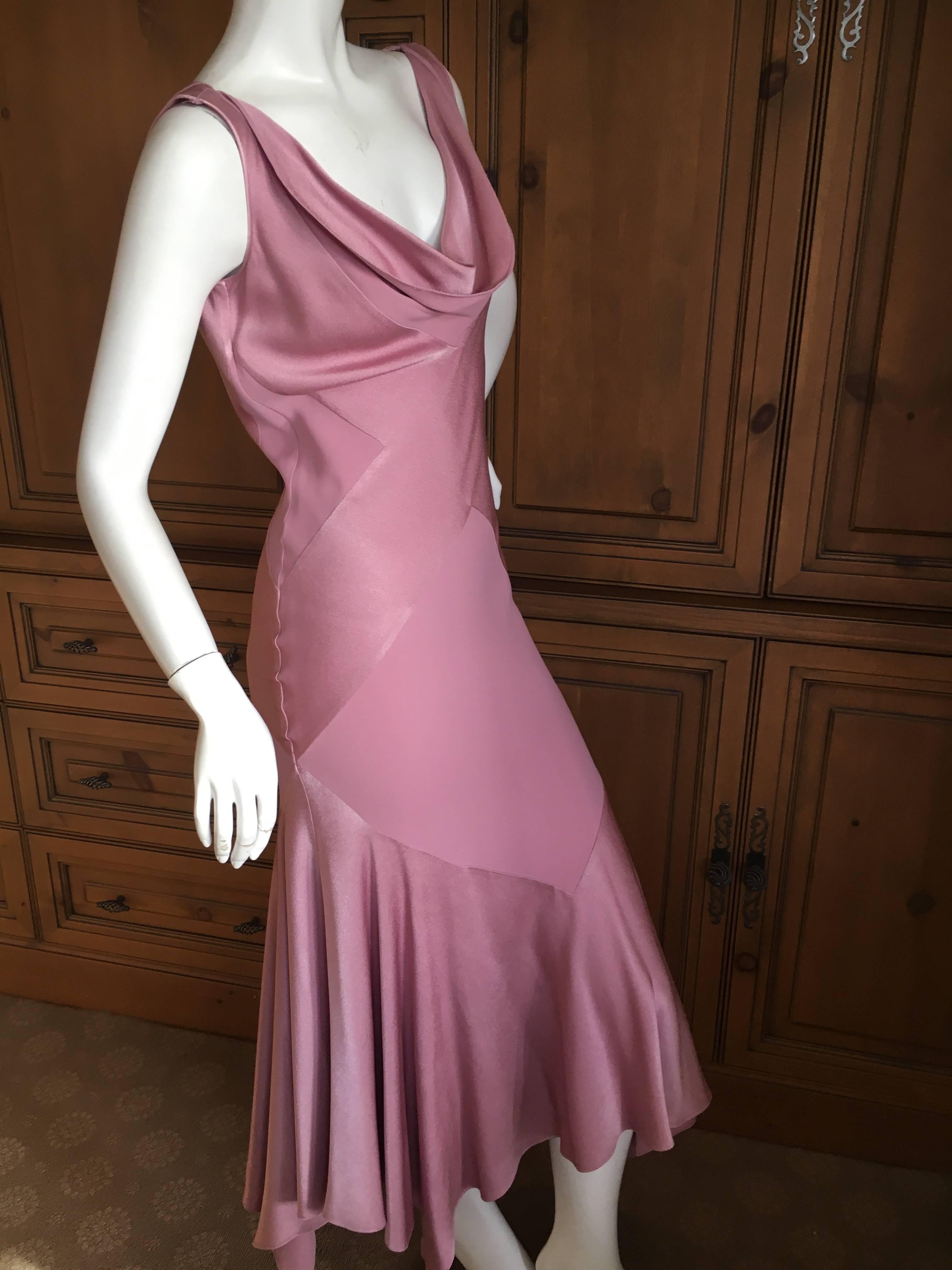 John Galliano 1990's Bias Cut Rose Color Diamond Pattern Cowl Front Dress.
From the early 90's, this has a matte / shine treatment, and has a cloth label from the earlier Galliano collection.
Size 40
Bust 42'
Waist 32