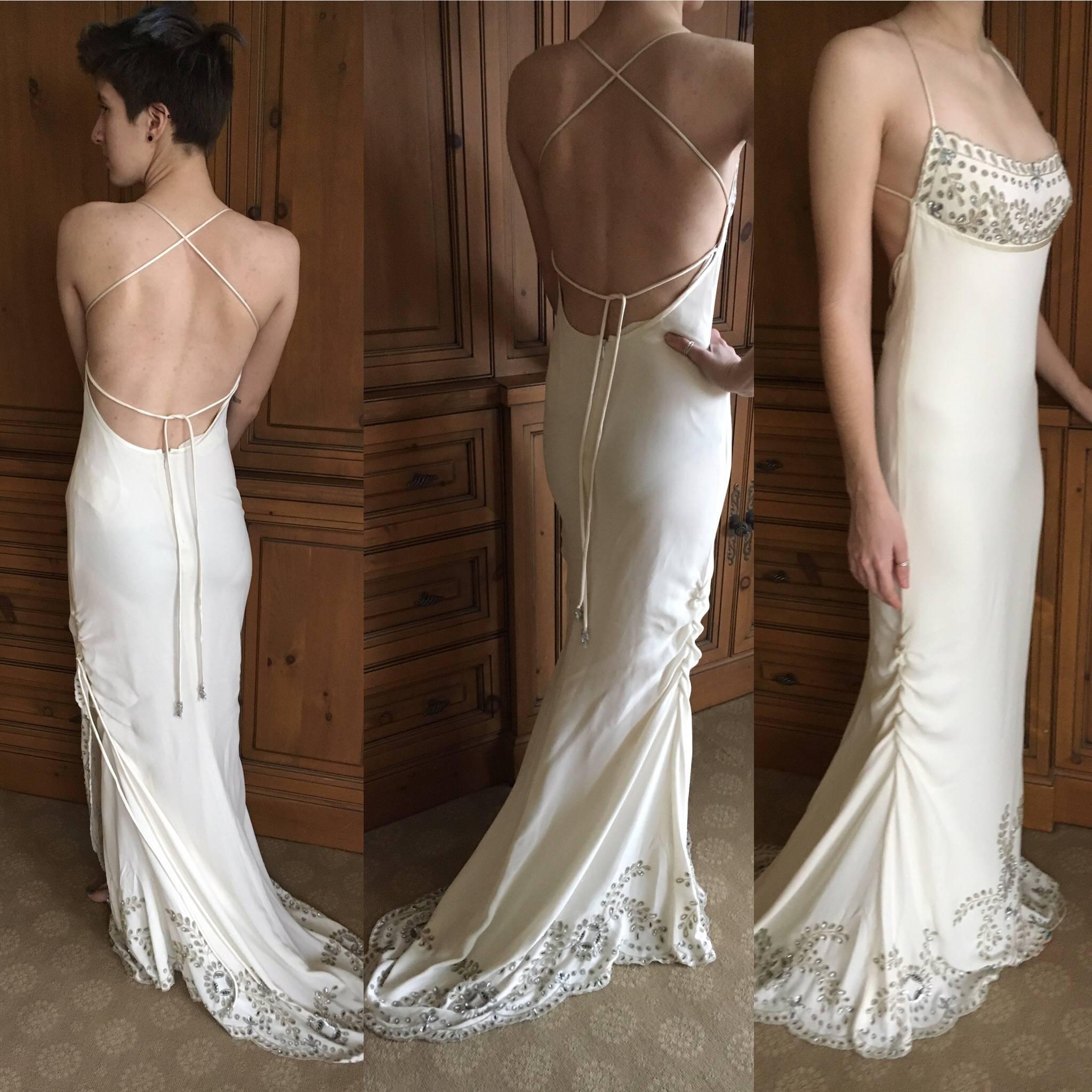 Exquisite custom made evening / wedding dress with Indian style embroidery in gold and silver thread on ivory silk crepe, trimmed in satin.
This is so beautiful, with a train .
Could be worn as an evening dress or wedding