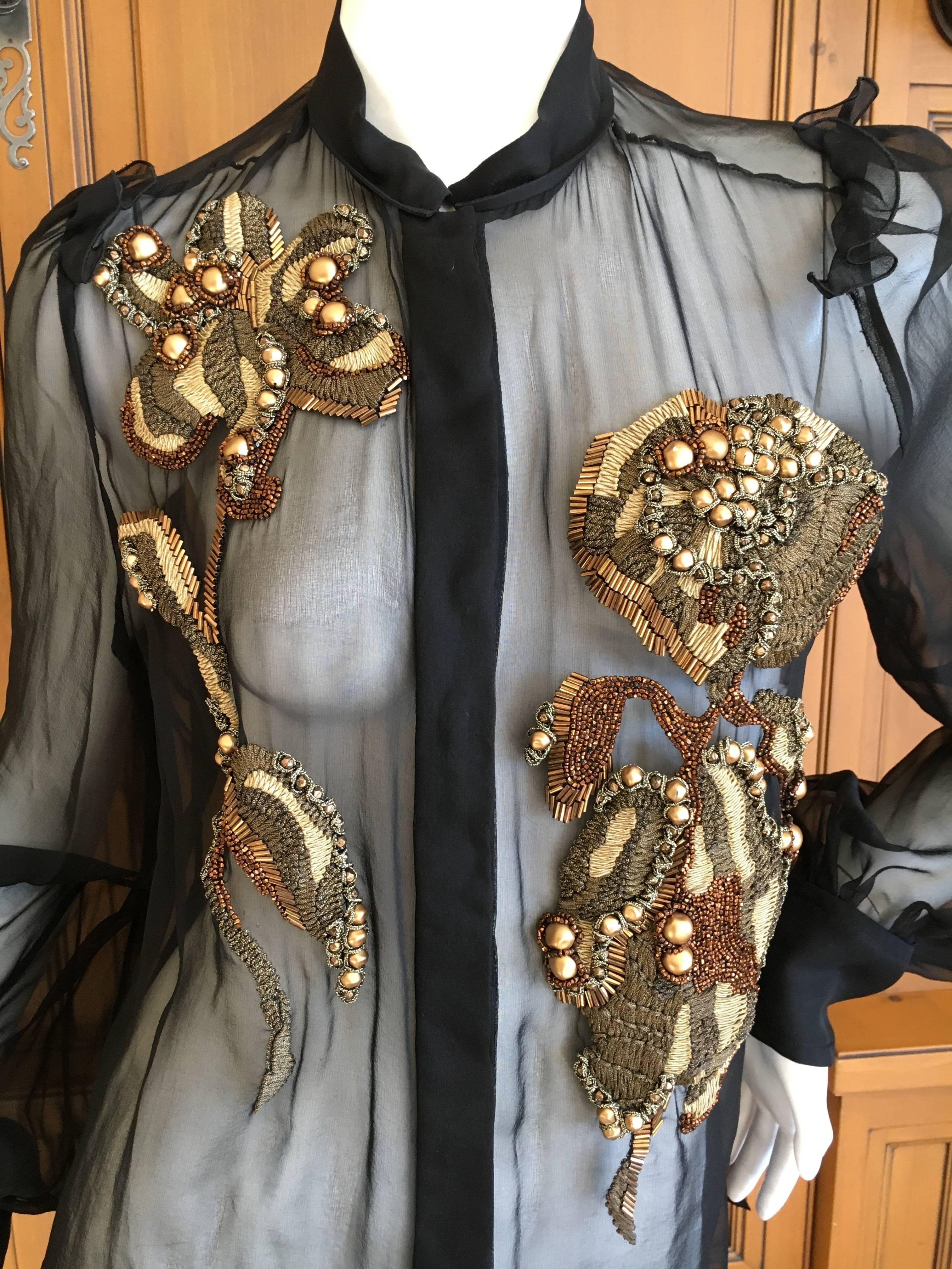Yves Saint Laurent Sheer Blouse with Lesage Embellished Iris Flowers.
Iris were a repeated theme in YSL embellished jackets and tops, and this is a wonderful interpretation in gold threads, sequins and beads.
Absolutely exquisite workmanship from