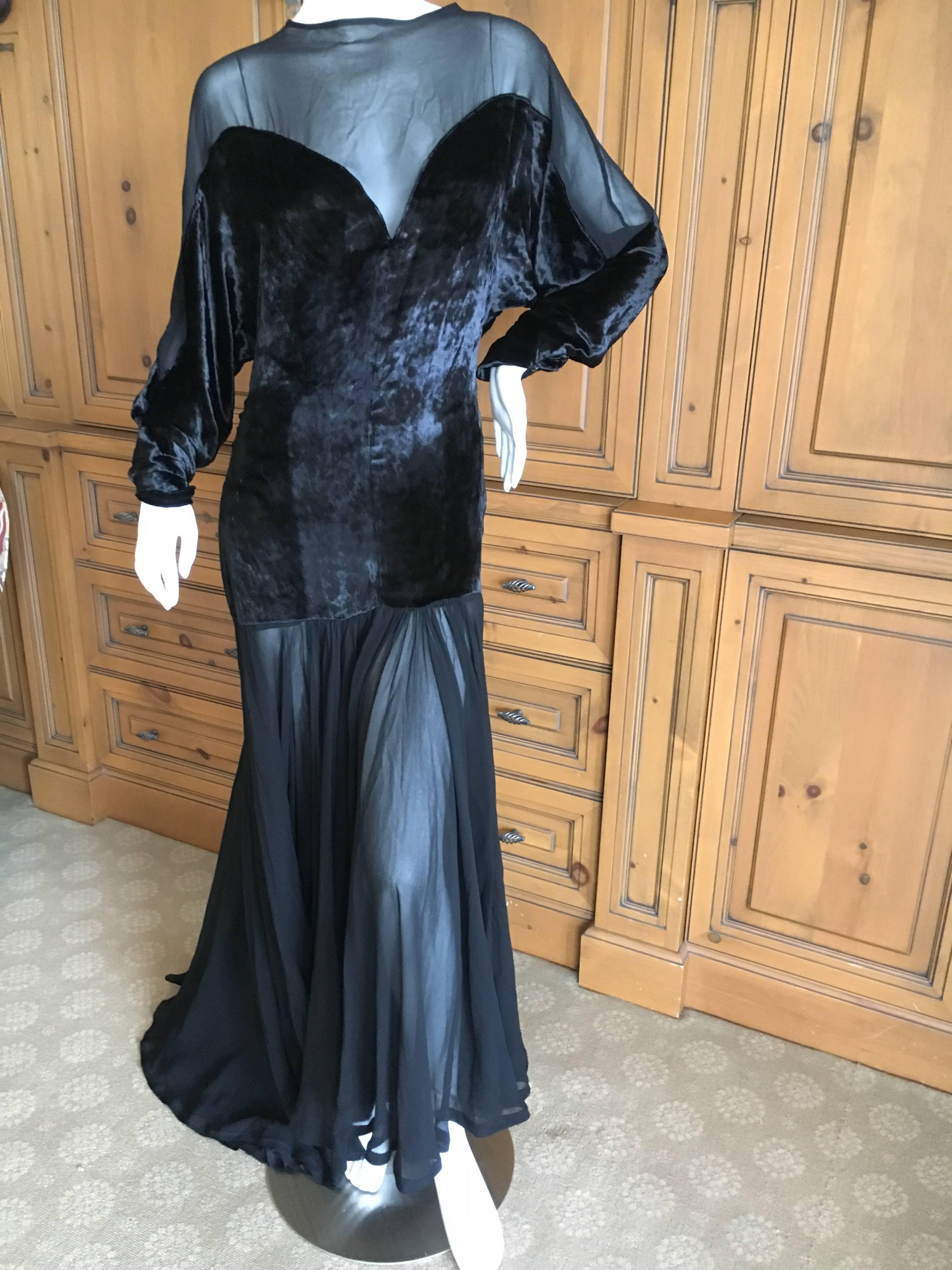 Thierry Mugler Black Velvet and Sheer Chiffon Evening Dress.
This is exquisite, with a velvet bodice and seductive sheer chiffon skirt and bust.
Pure Thierry Mugler drama.
Bust 40"
Waist 30"
Hips 45"
Length 60"
There is a