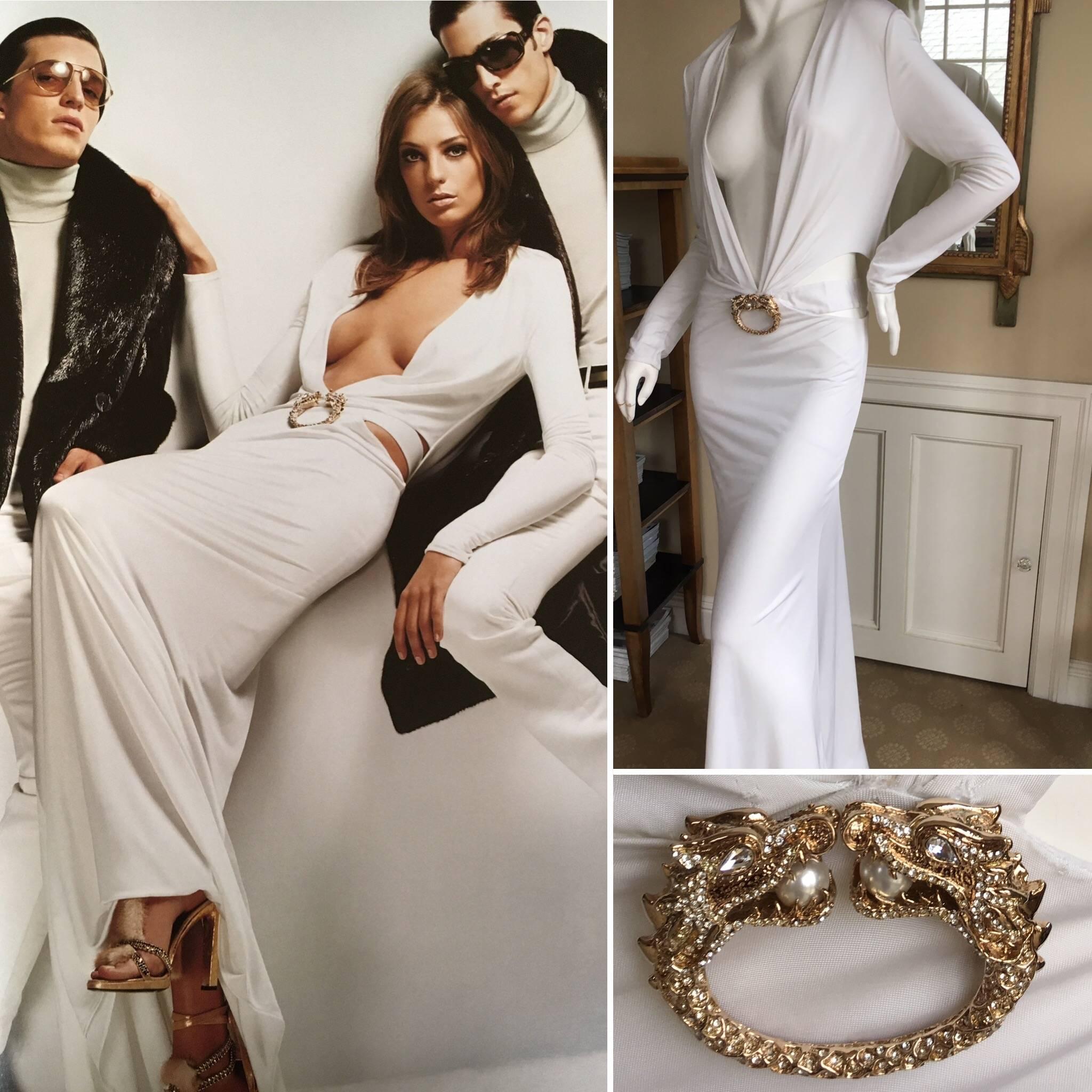 Iconic low cut white evening dress with jeweled dragon from Gucci by Tom Ford 2004.
As featured on Daria in the Gucci Ad.
Super low cut bust, with a keyhole back.
Includes inner "belt", but it has been separated from the dress.
For the