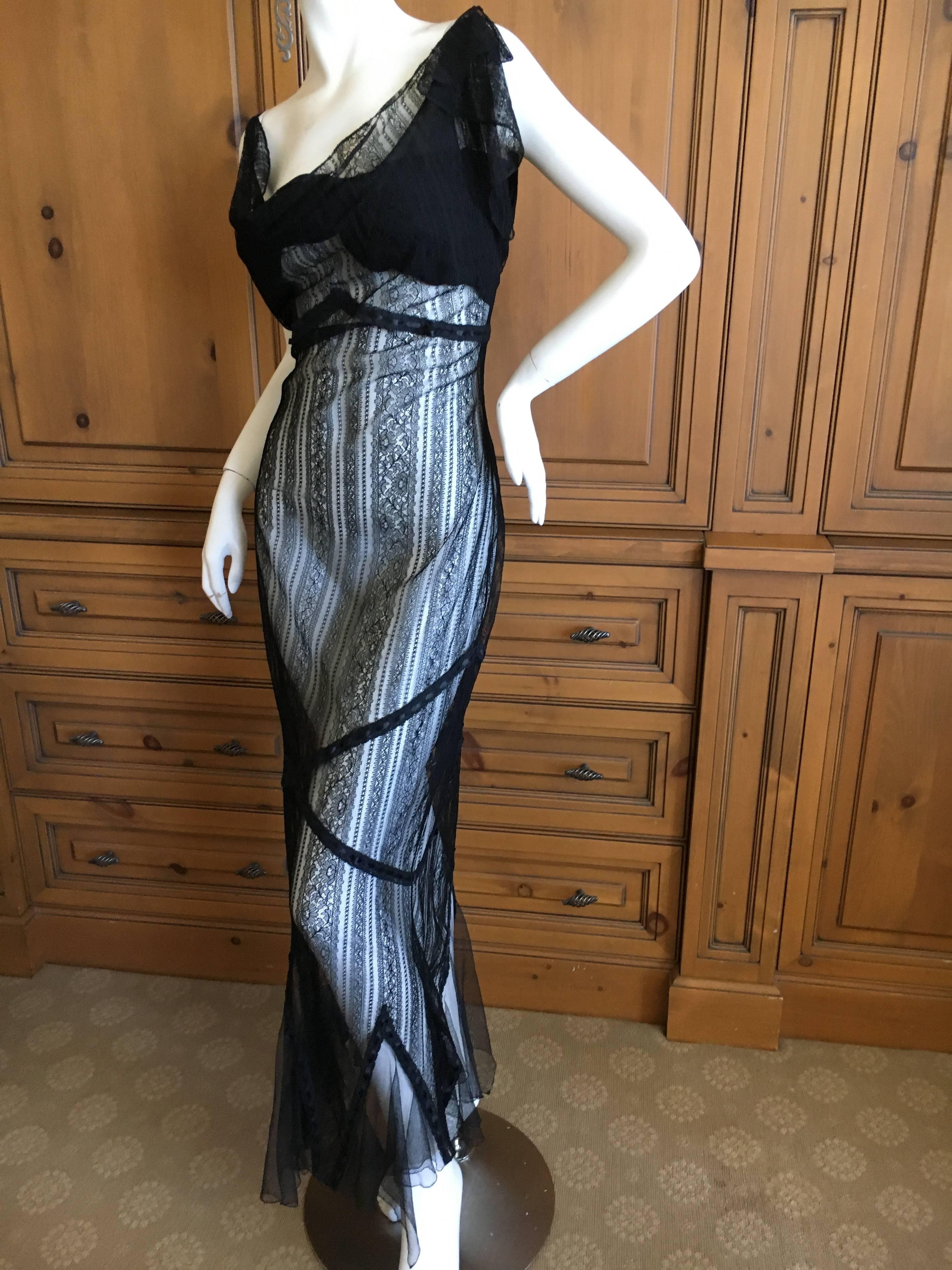 John Galliano Elegant Vintage Black Lace Evening Dress.
There is an underslip and the hemline matches the lace.
I also show the dress with the slip hiked up, as I have a client who always removes the slip from these great Galliano's and wears them