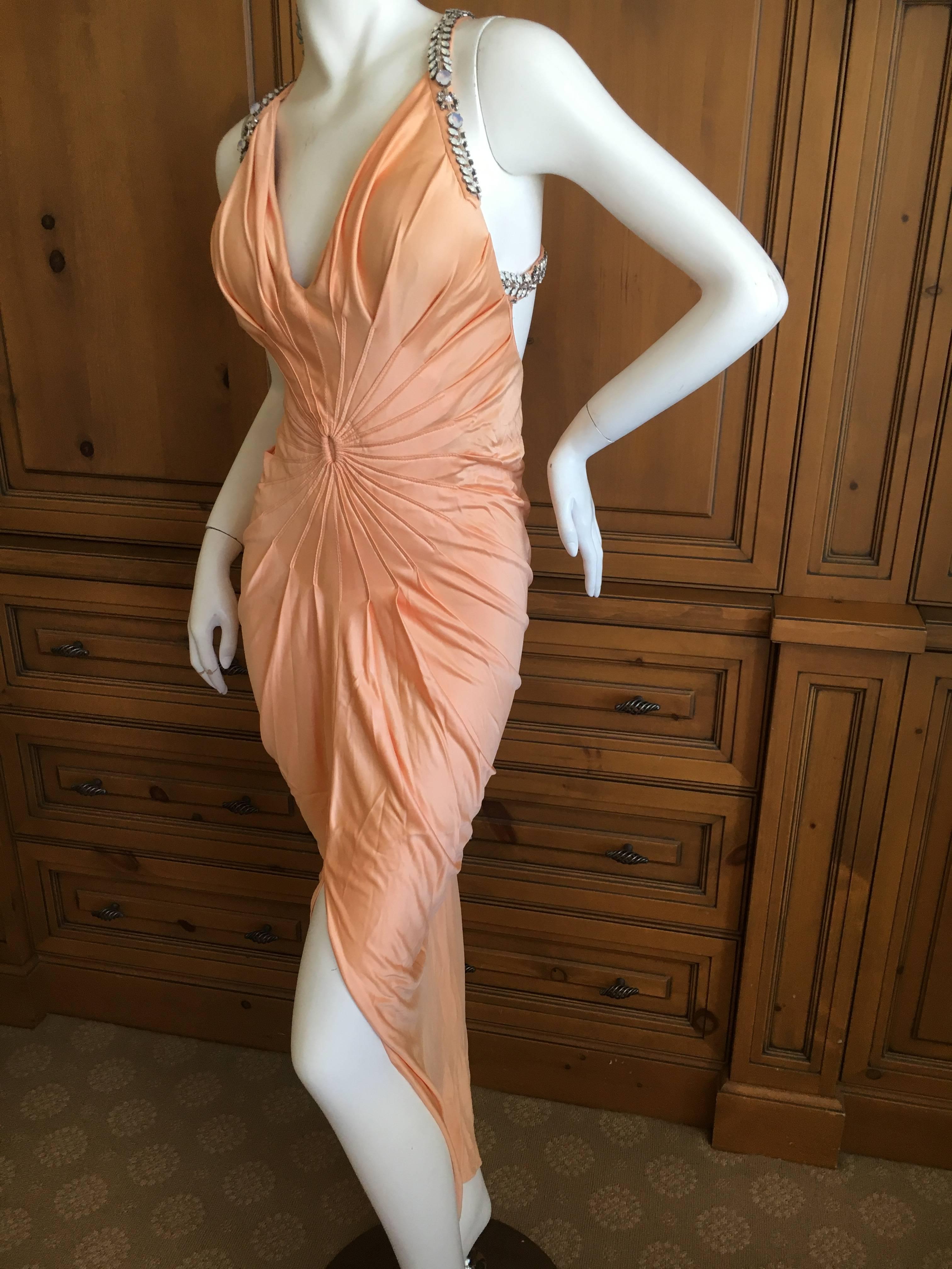 Vintage Versace Jersey Evening Dress with Cross Back Jeweled Straps.
This is much prettier in person, the jewels are very eye catching.
There are foam cups sewn in to this, they can easily be removed.
Bust 36"
Waist 26"
Hips