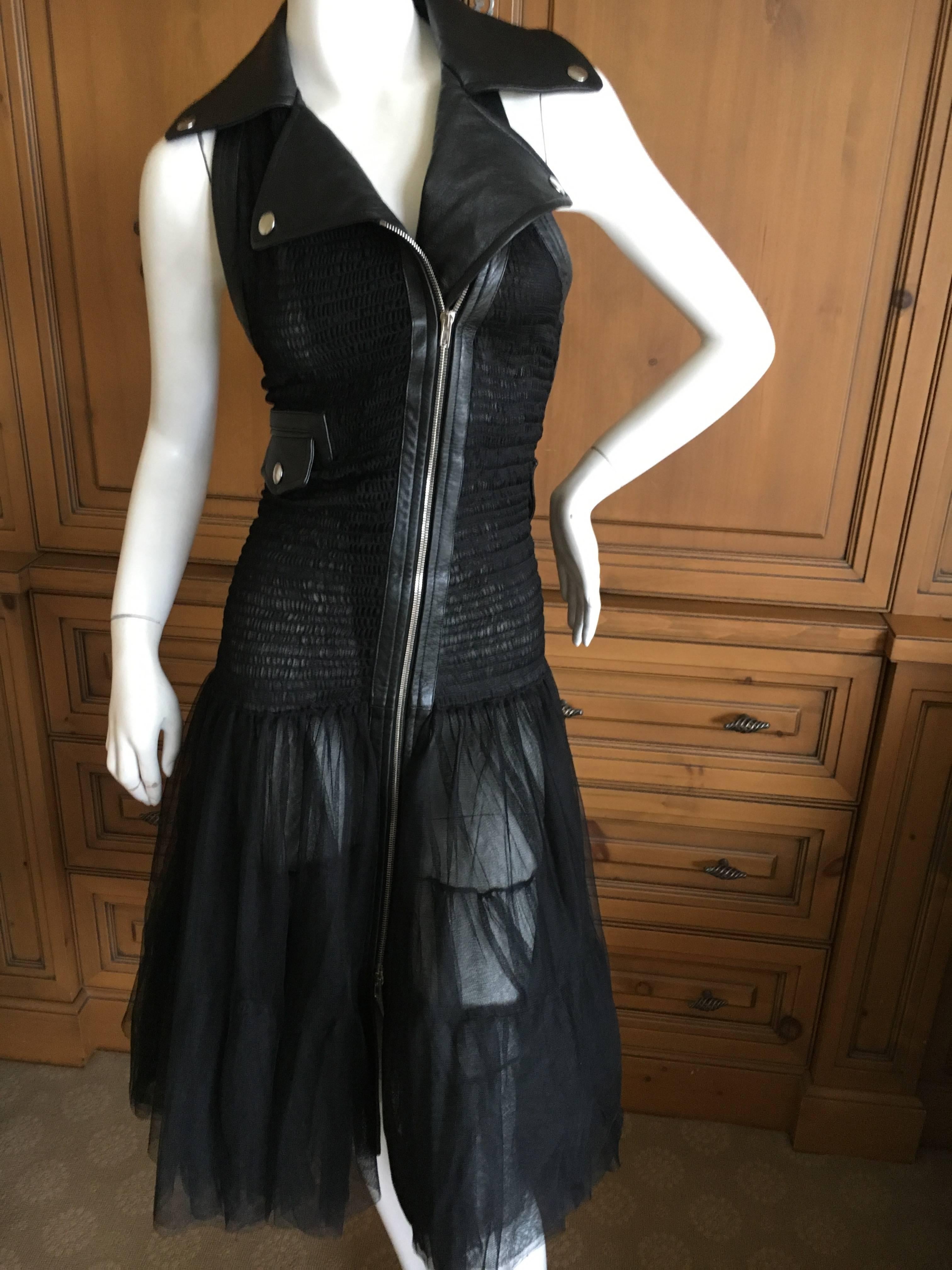 Jean Paul Gaultier Sheer Black Leather Trimmed Moto Style Dress.
Styled like a leather moto jacket but with sheer ruched and pleated fabric.
This is so pretty on, the photo's don't quite capture it.
Size 42
Bust 39"
Waist 30"
Hips