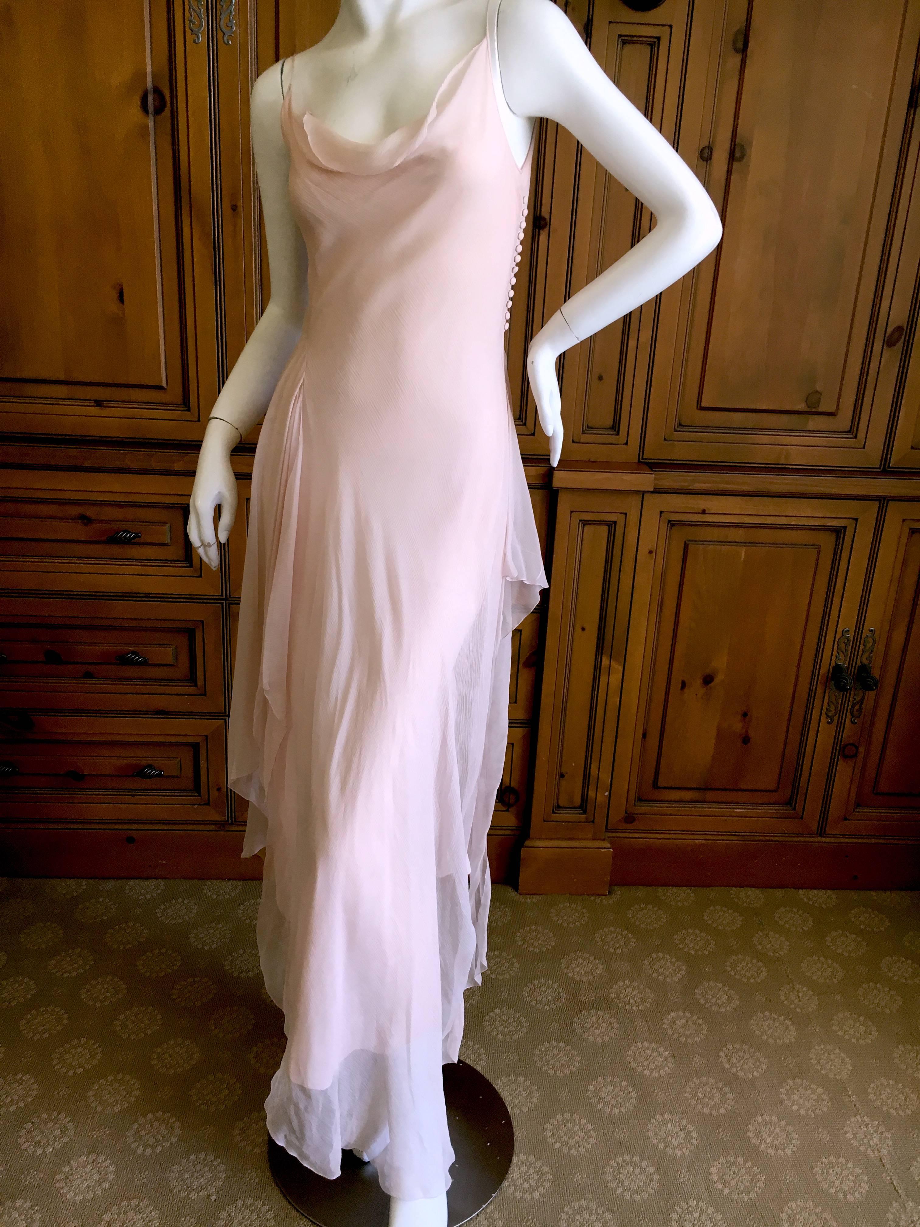Divine diaphanous blush silk chiffon dress from a very early John Galliano.
This is an early label, when his pieces were still made in France.
Bias cut with multi layers of draping sheer silk chiffon, this is so pretty on.
There is a lot of stretch