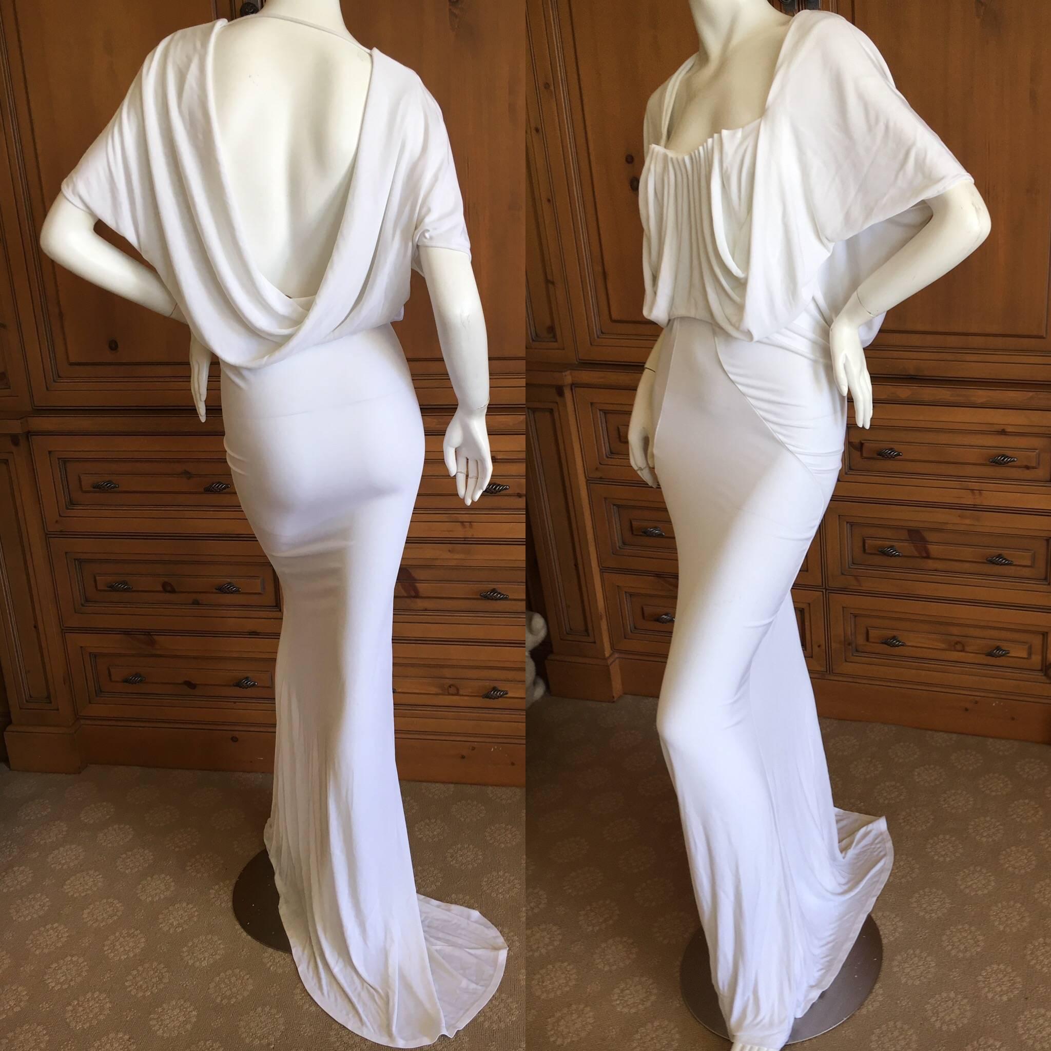 John Galliano Vintage Draped Back White Goddess Gown with Train .
This would Make a Sweet Wedding Dress.
Accordion pleating at the bust, with an elegant draped back, slight train.
Size Small

 Bust 36" 
Waist 25"
 Hips 38"
 Length