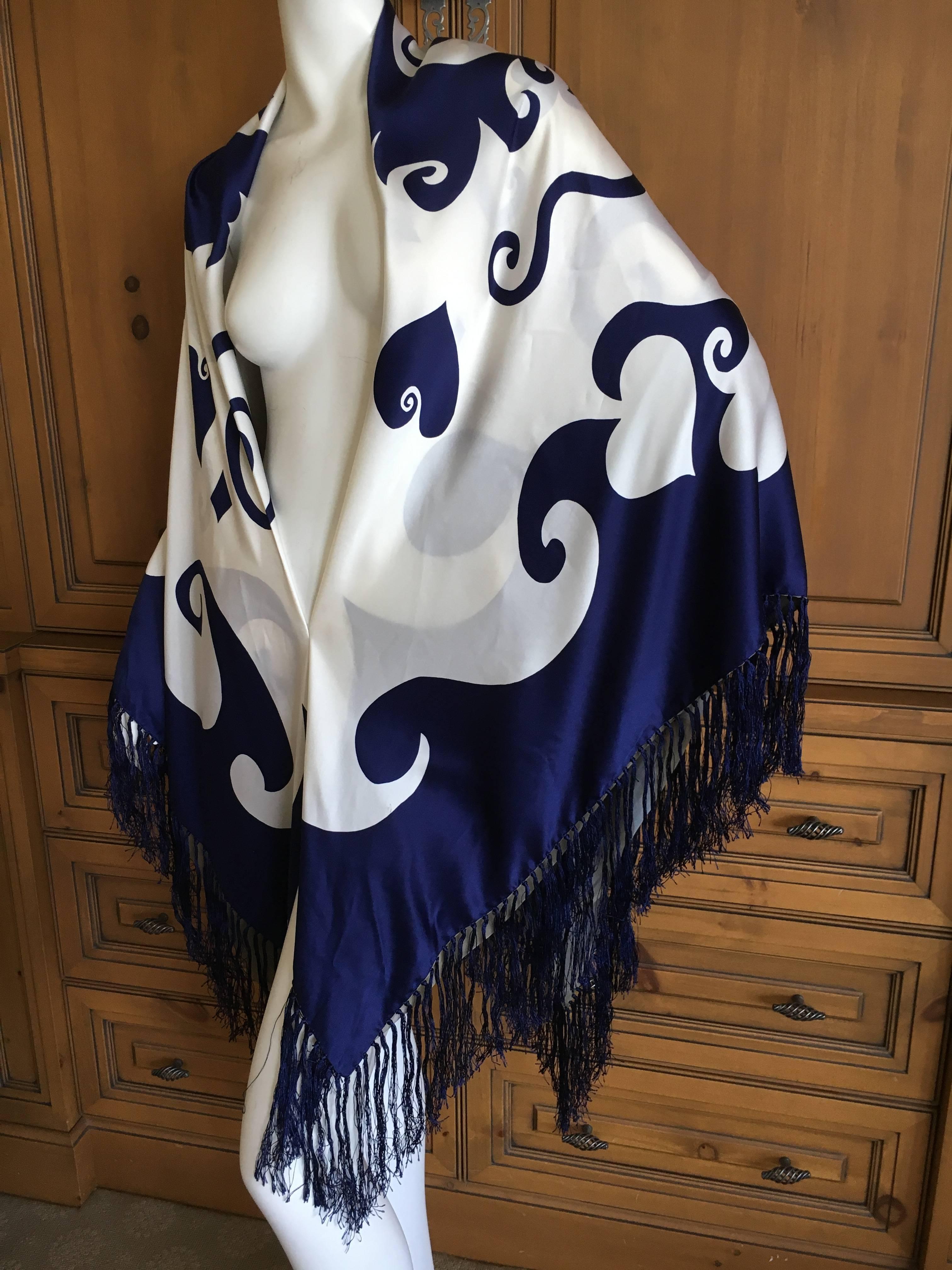 Christian Lacroix Arlesienne Pattern Reversible Silk Piano Fringe Scarf.
There are multi layers of silk , two silk chiffon layers to creat the inside reversible pattern.
With out the fringe it measures 52"

