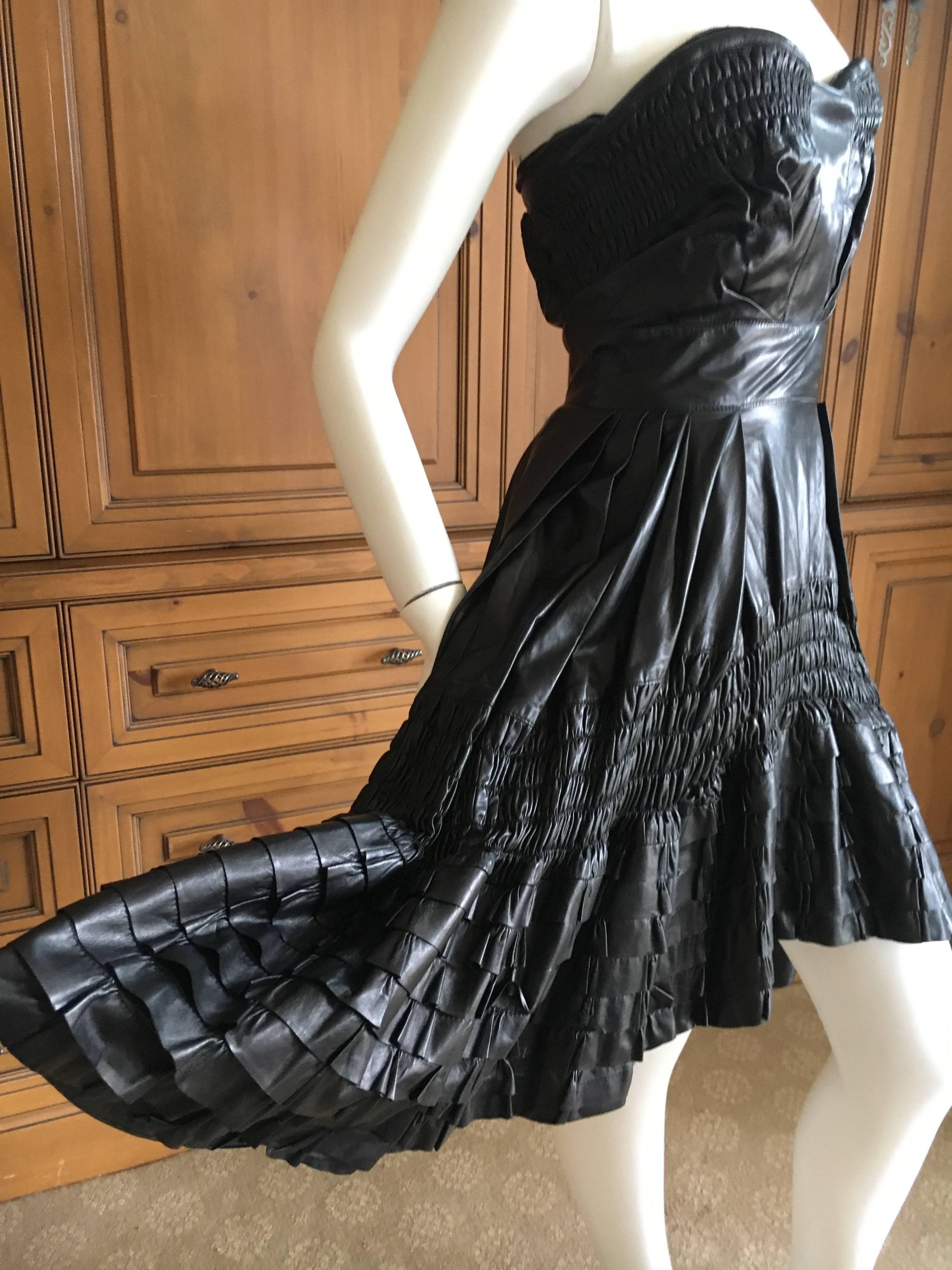 Christian Dior by John Galliano Fall 2010 Black Lambskin Leather Pleated Ruffle Dress.
There is an interior corset attached.
This is so much prettier on a real girl, see runway shot's.
Size 36, there is a lot of stretch in the way this was