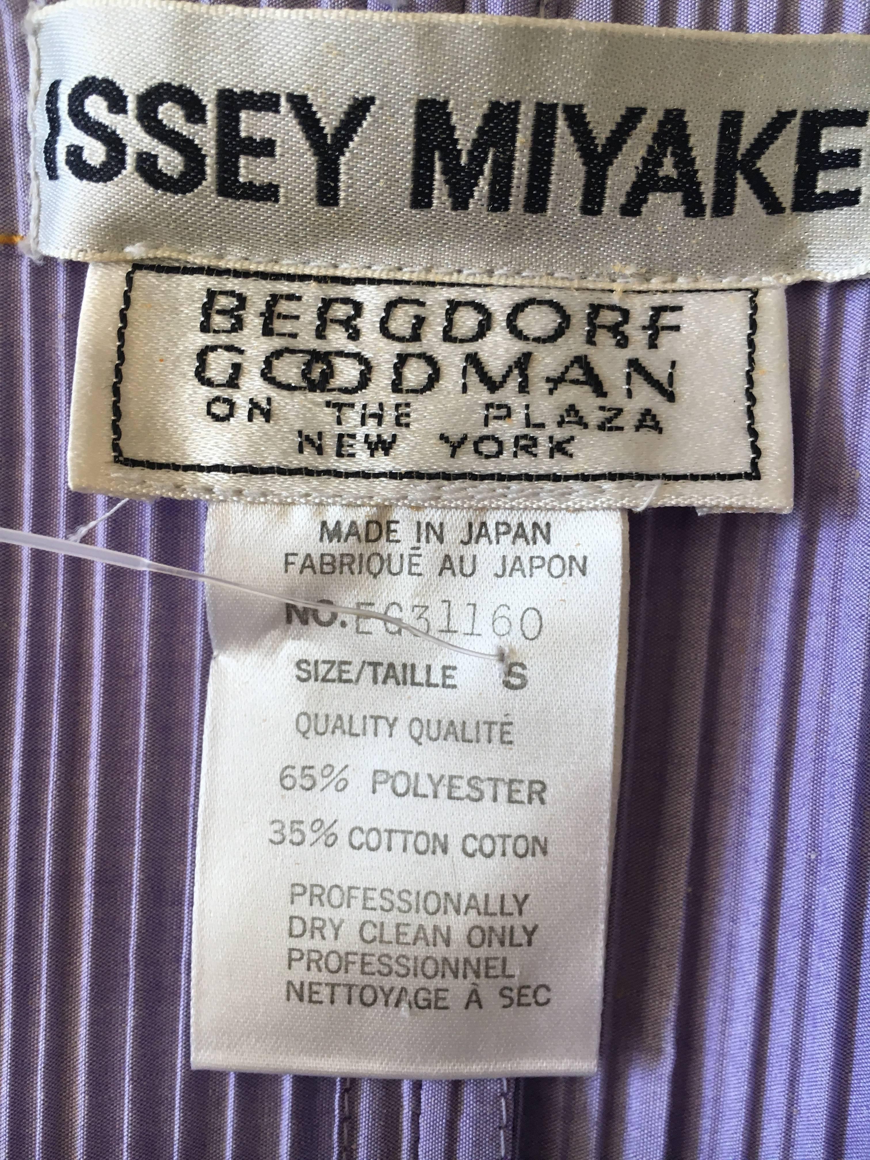 Wonderfully witty pleated purple suit from Issey Miyake for Bergdorf Goodman with a trompe L'oeil yellow top stitch throughout, like a denim jacket and pants.
Subtle , so chic.
Size Small
Pant 
Waist 22"
Hips 40"
Inseam 27"
Excellent