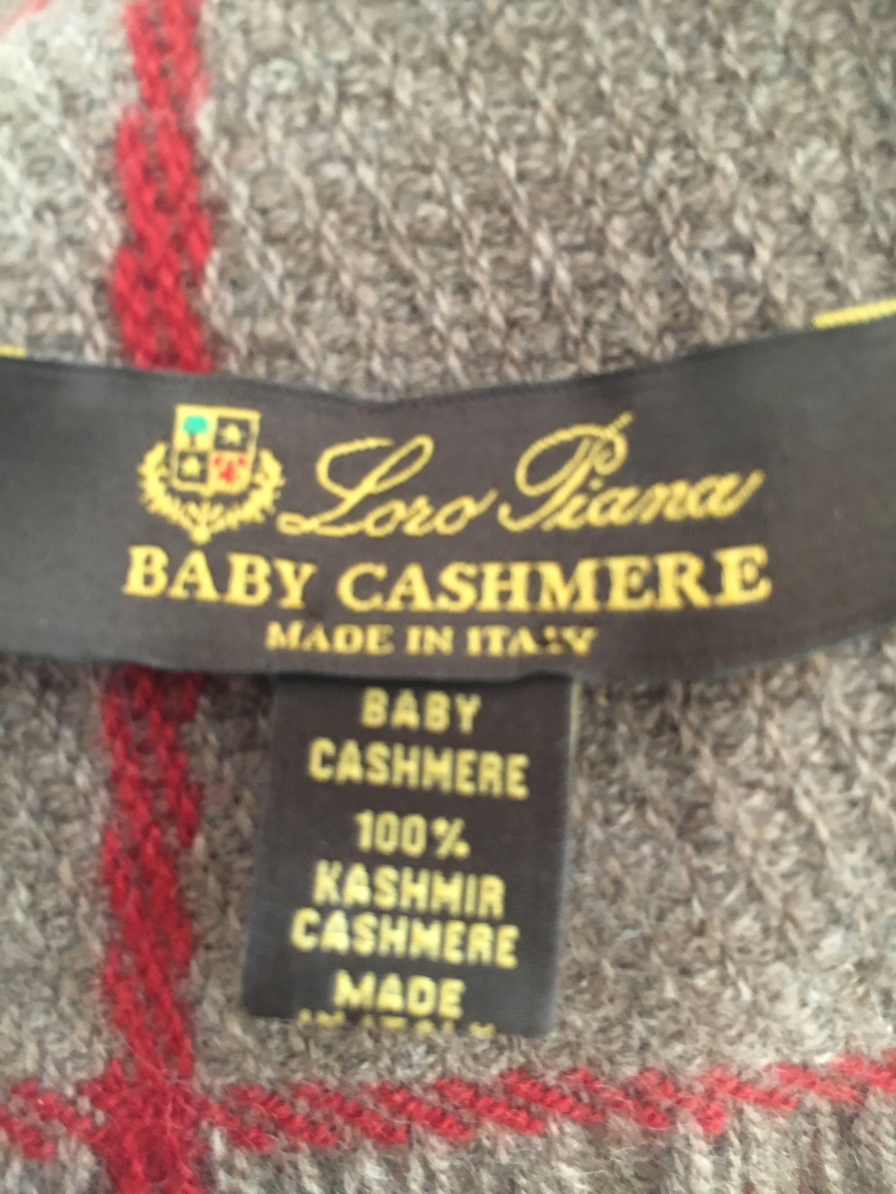 Super luxurious baby cashmere scarf or shawl from Loro Piana .
It is an oatmeal color with red check
17" x 76"
Excellent condition , minor pilling