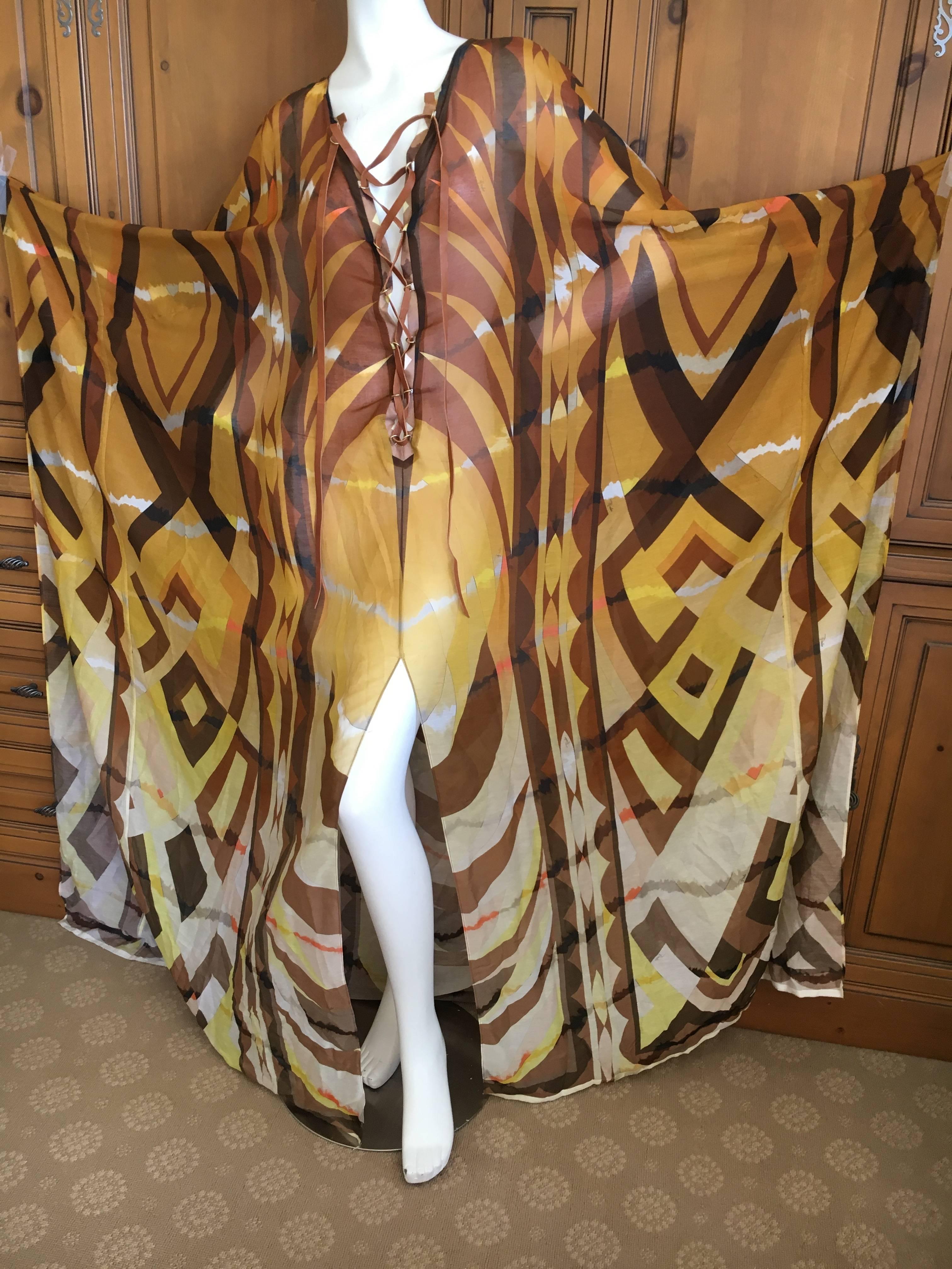 Emilio Pucci Sheer Patterned Caftan with Leather Lace Up Straps New with Tags.
Exquisite sheer silk cotton blend patterned caftan with leather lace up collar from Emilio Pucci.
Brand New , unworn with tags.
Marked size 40, seems to run large.
Never