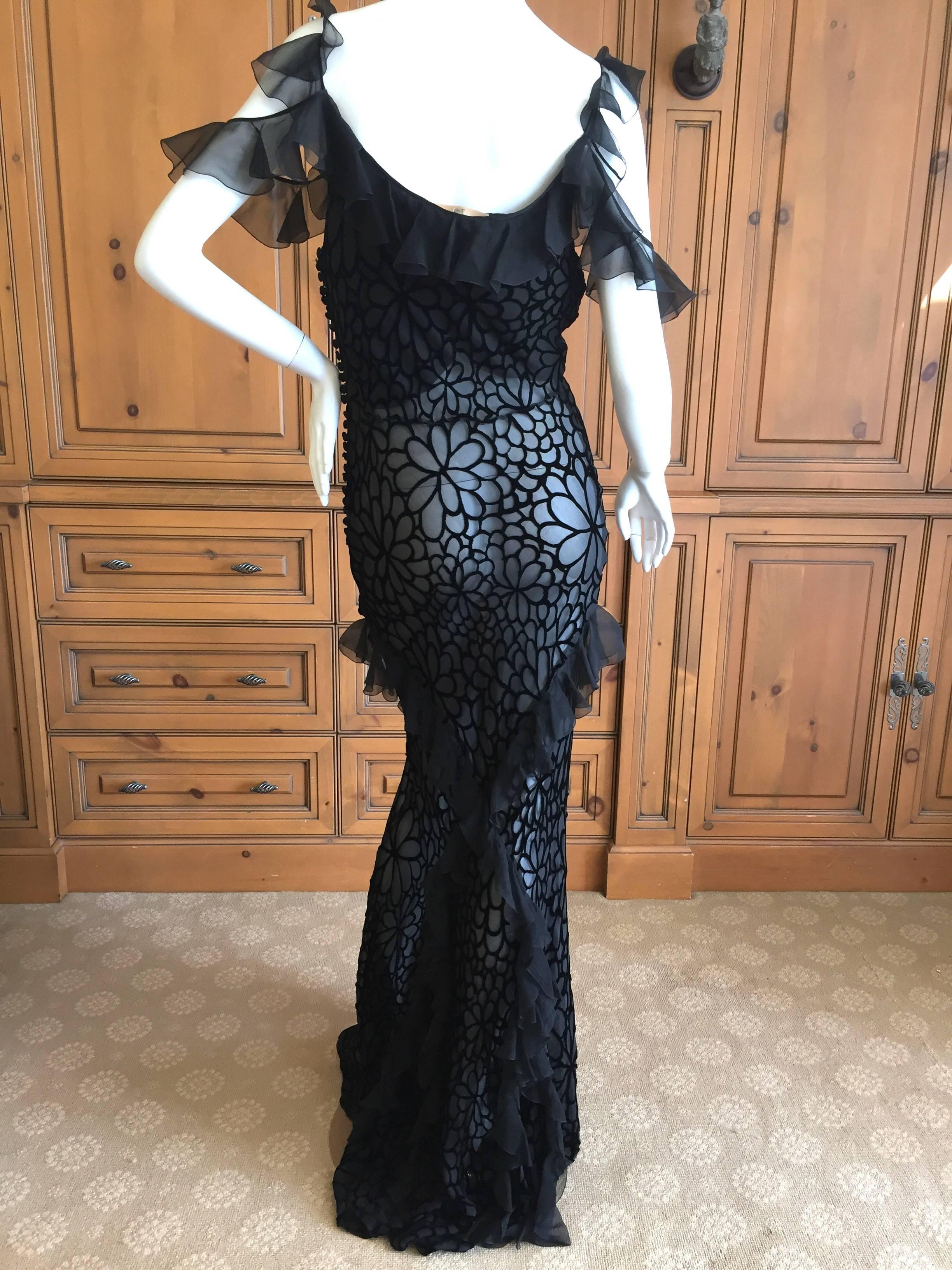 Elegant black ruffled evening gown from John Galliano.
Made of cut out devore velvet, this comes with a slip attached, but I think it would be wonderful removed.
I show it with the slip, and also where I hiked up the slip to show the wonderful