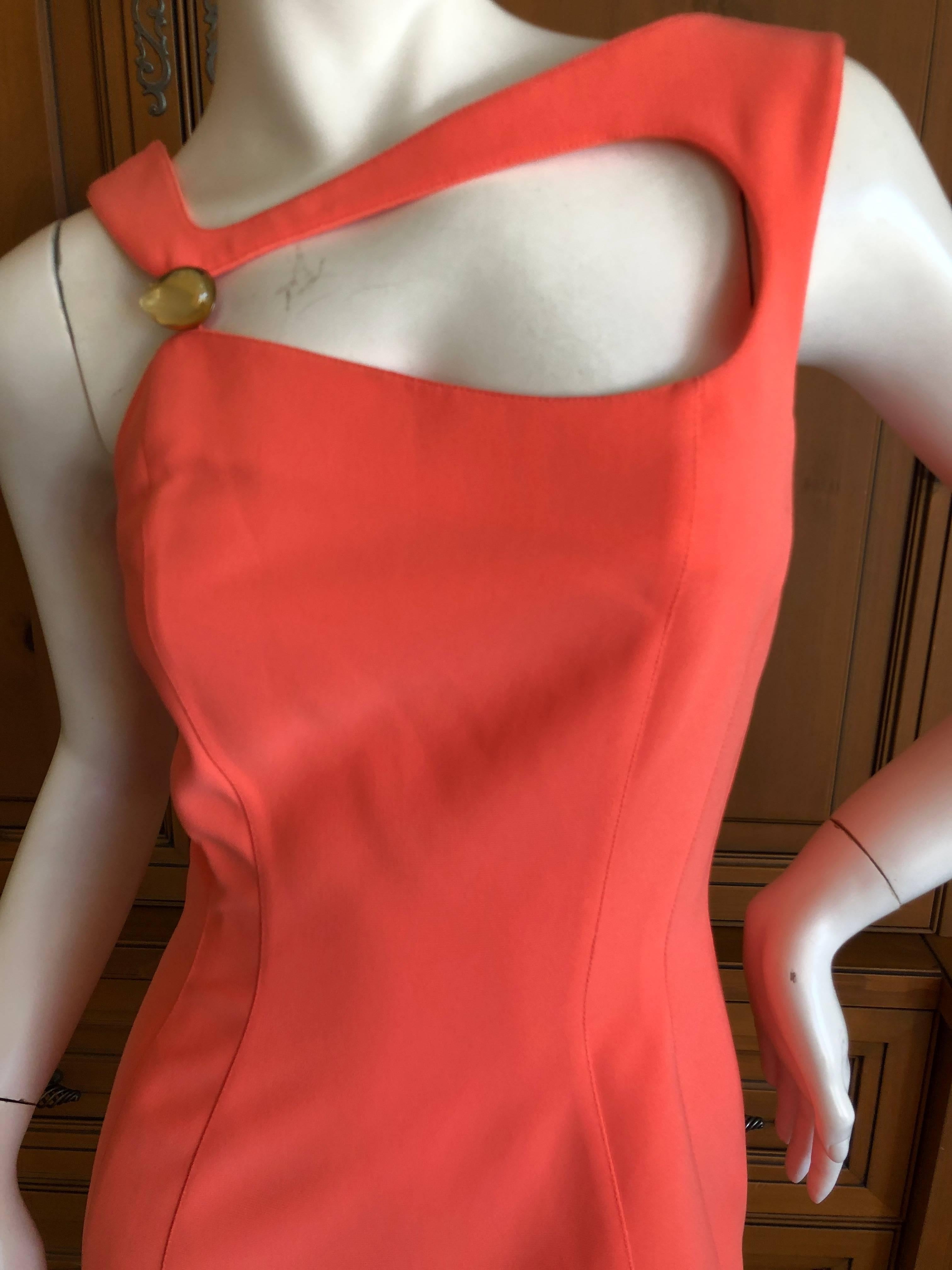 
	
	
Thierry Mugler Mod Vintage 80's Tangerine Cut Out Dress with Cabochon Ornament 
Size 36

Bust 32" 

Waist 28"  

Hips 39" 

Length 42"

 Excellent condition