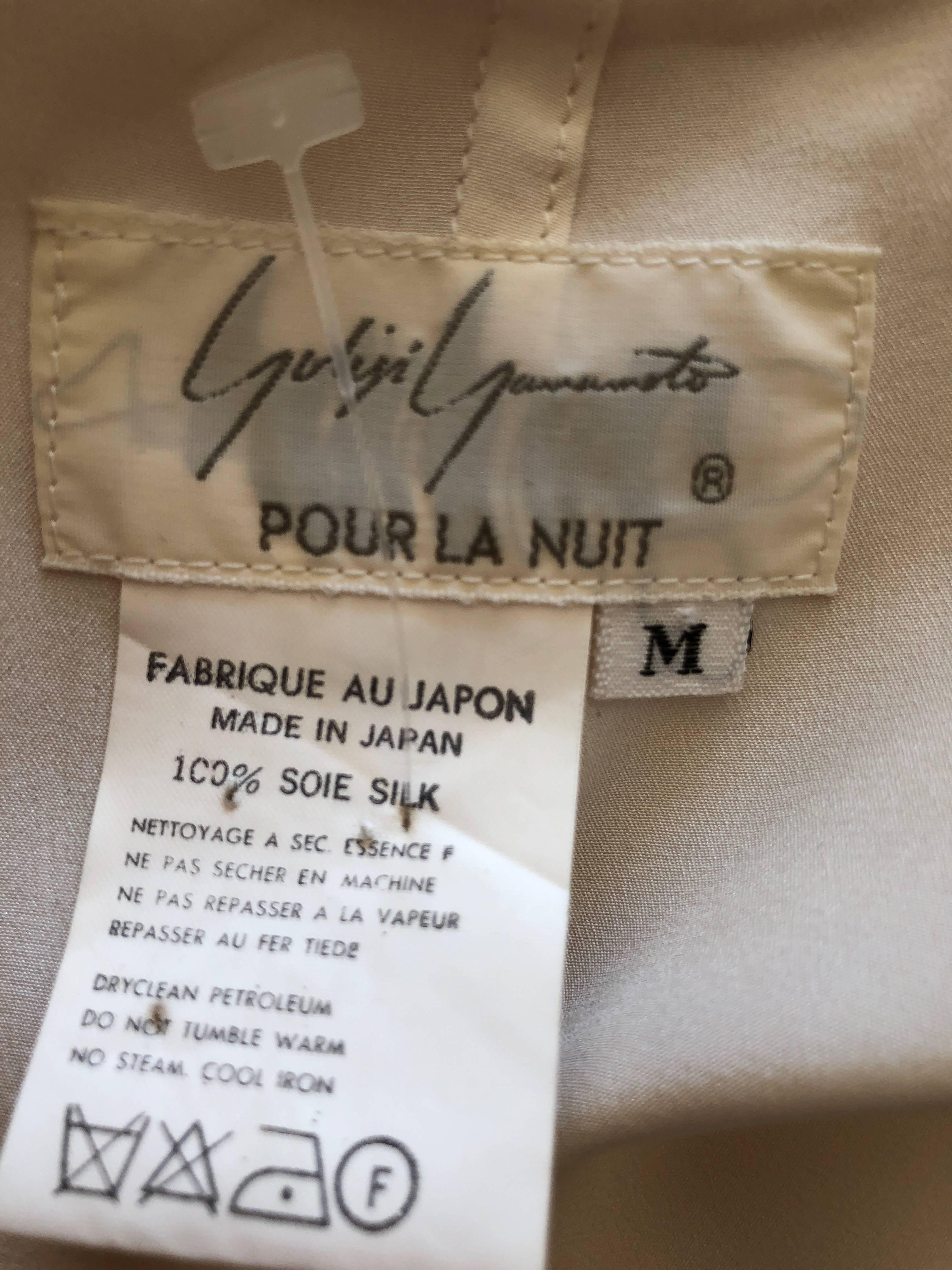 Yohji Yamamoto 1990's Silk Wrap Blouse. This is so pretty, and wraps to close.
Could be worn as a tunic or micro mini dress.
The label reads "Yohji Yamamoto Pour la Nuit".
Pure silk
Marked Size M
Bust 38"
Length 30"