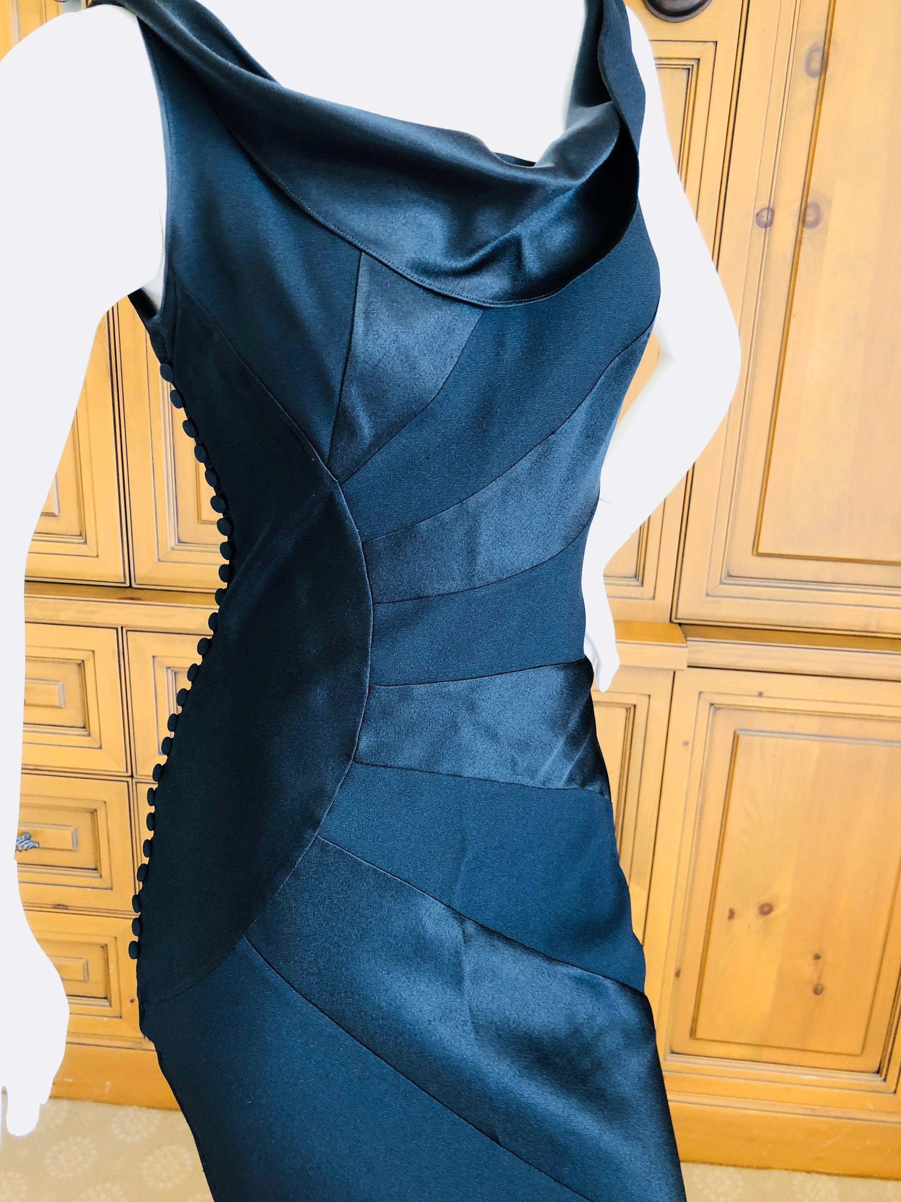 Exquisite black evening dress with a sunburst pattern created by using both the matte and shine surfaces of the fabric, a Galliano signature.
Spring Summer 2000.
Difficult to photograph, this is lovely.
Size 40
Bust 38'
Was it 28