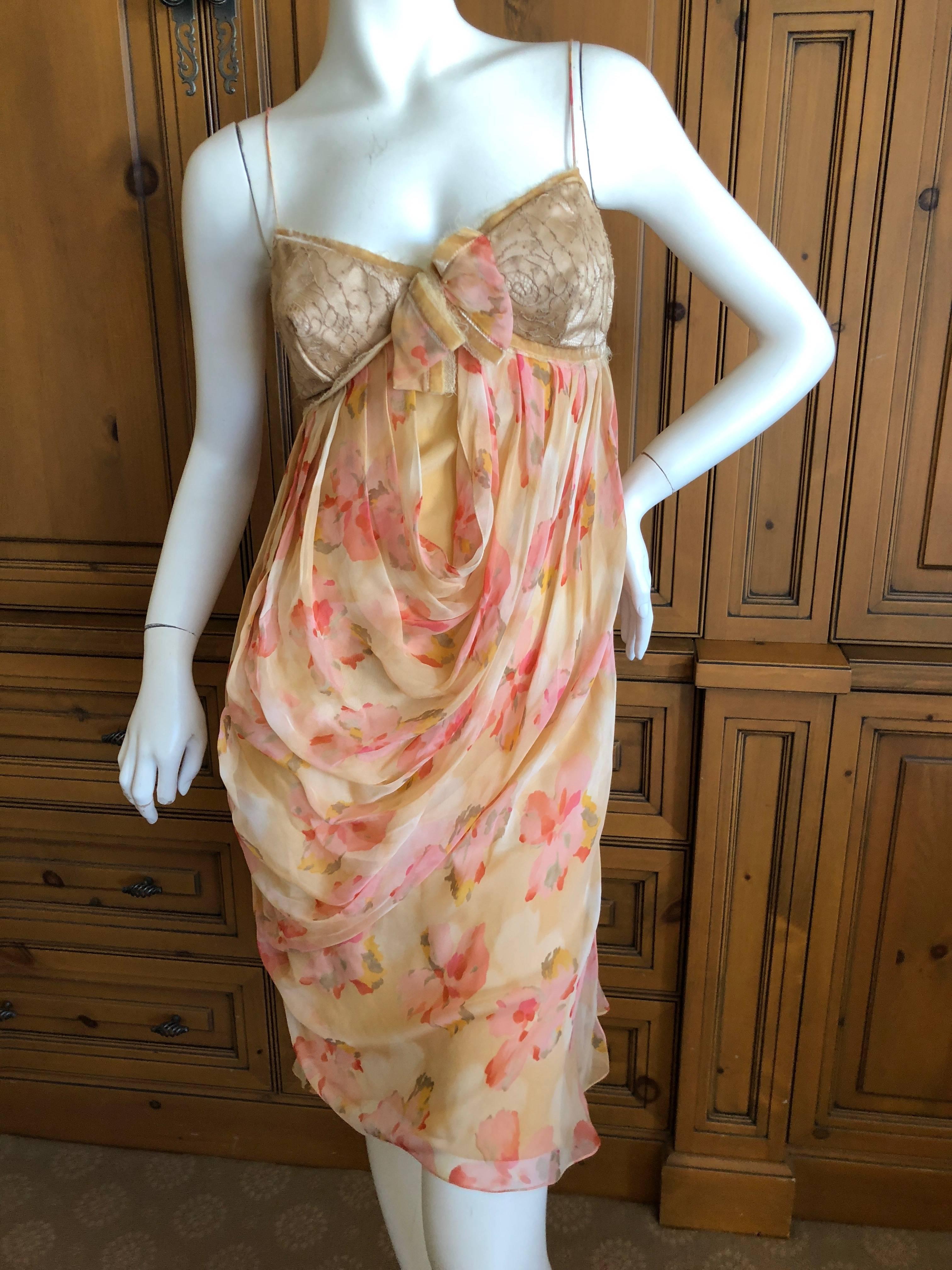 
	
	
Christian Dior by John Galliano sweet floral draped dress with lace details on the bra.
This is so pretty, with lace inserts and a bra like bust.
Classic Galliano / Dior
Size 40
Bust 34