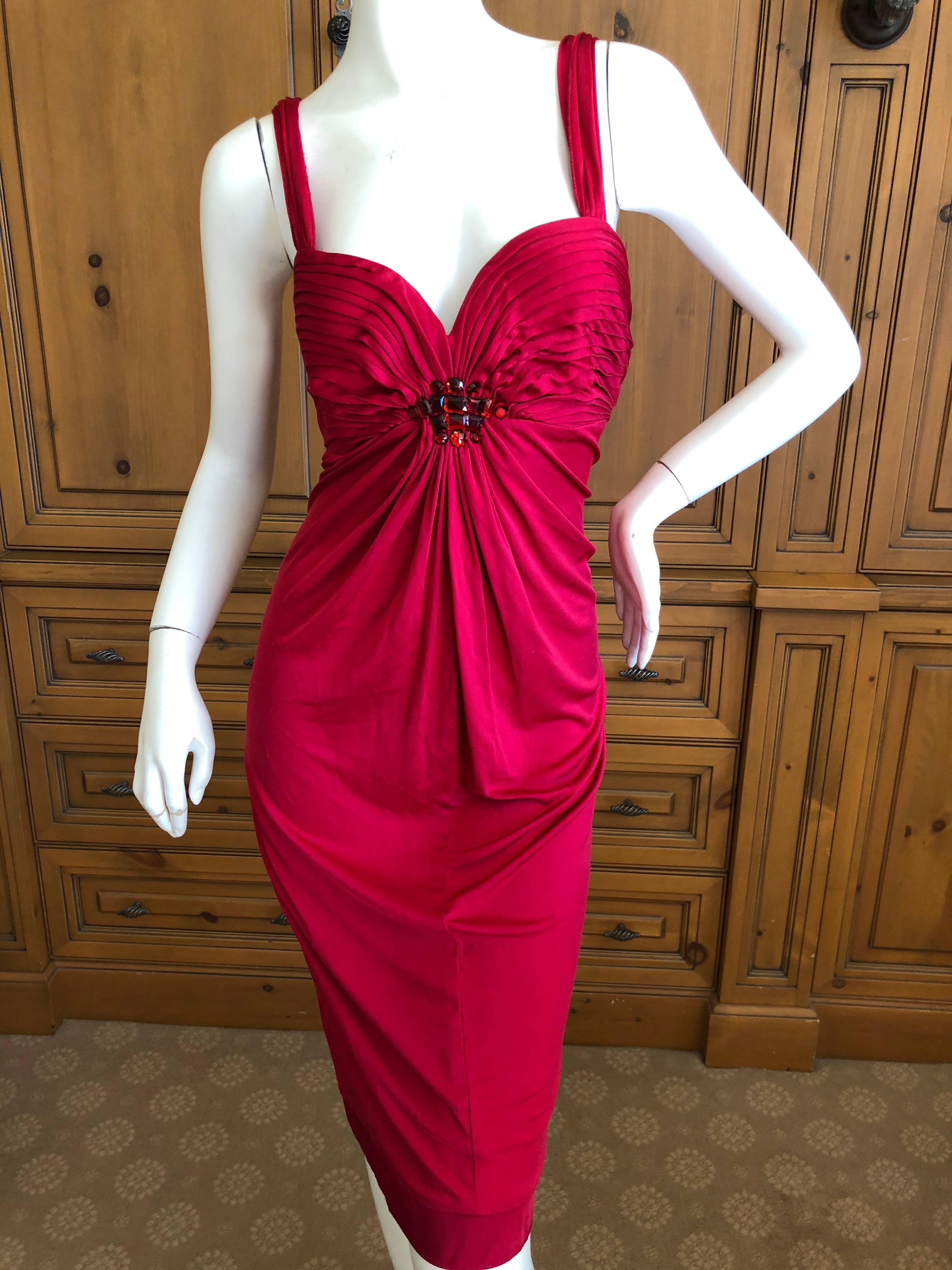 Christian Dior Crystal Embellished Red Cocktail Dress .
Lined in silk, the dress is made of viscose acetate blend.
Size 40
 Bust 34