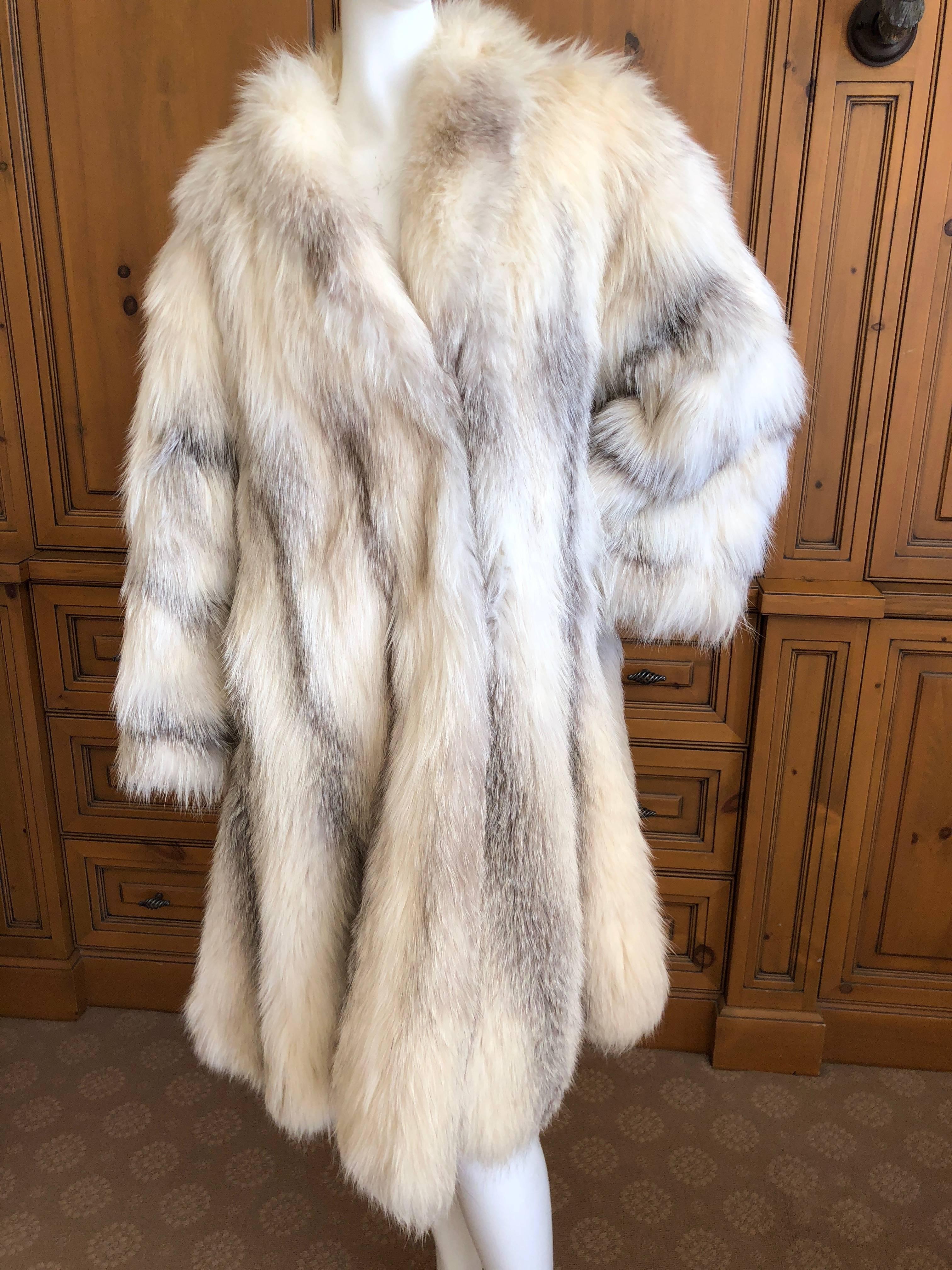 Gianni Versace Furs 1980's genuine fox fur swing style coat with wonderful generous proportions.
The sweep measures 110