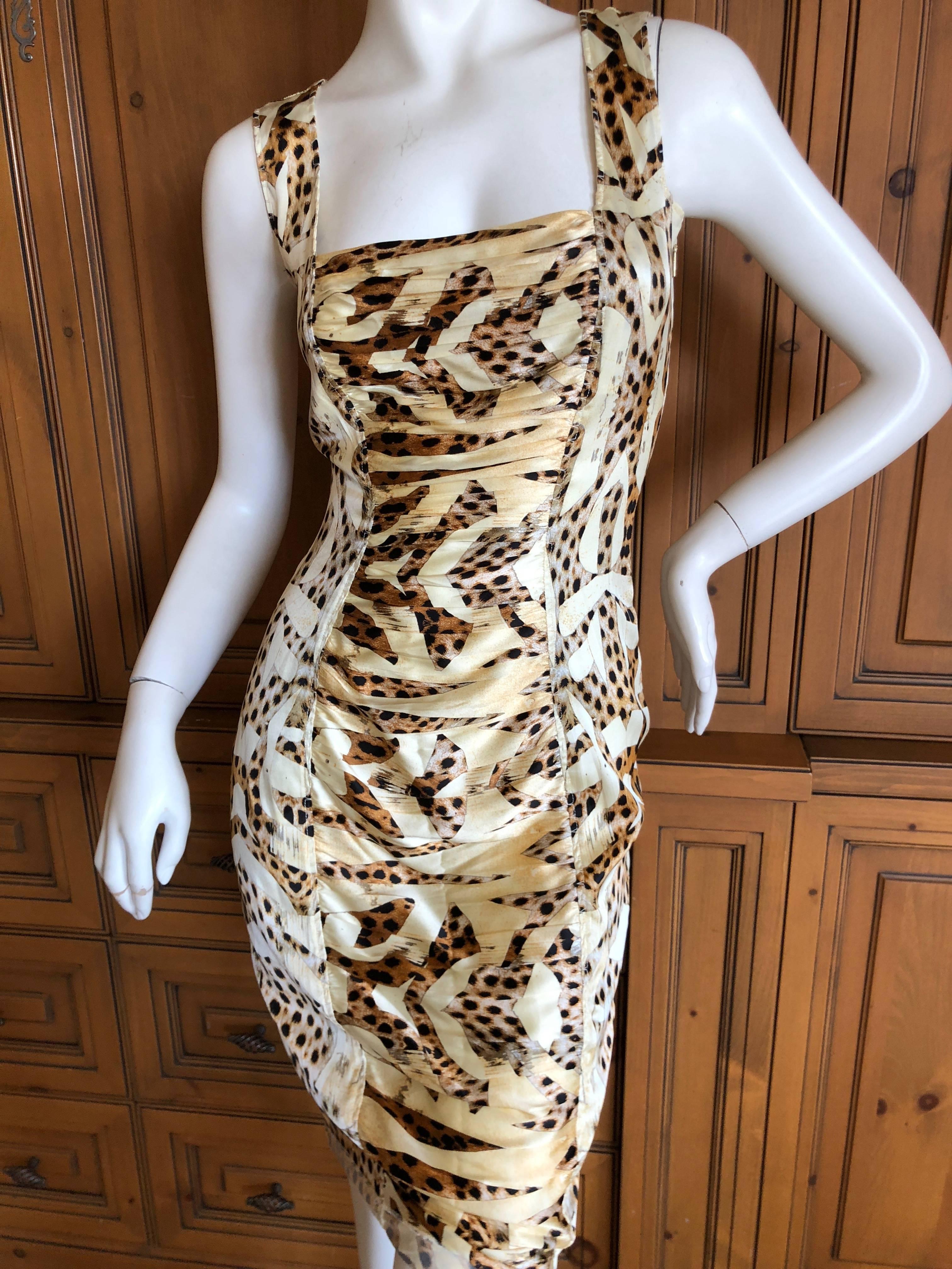 Roberto Cavalli Lovely Vintage Ruched Silk Leopard Print Dress.
This is so pretty, the photos don't do it justice. 

There is a lot of gold in the fabric patterns .

There is elasticized ruching , and a lot of stretch  

Size 40

Bust 36