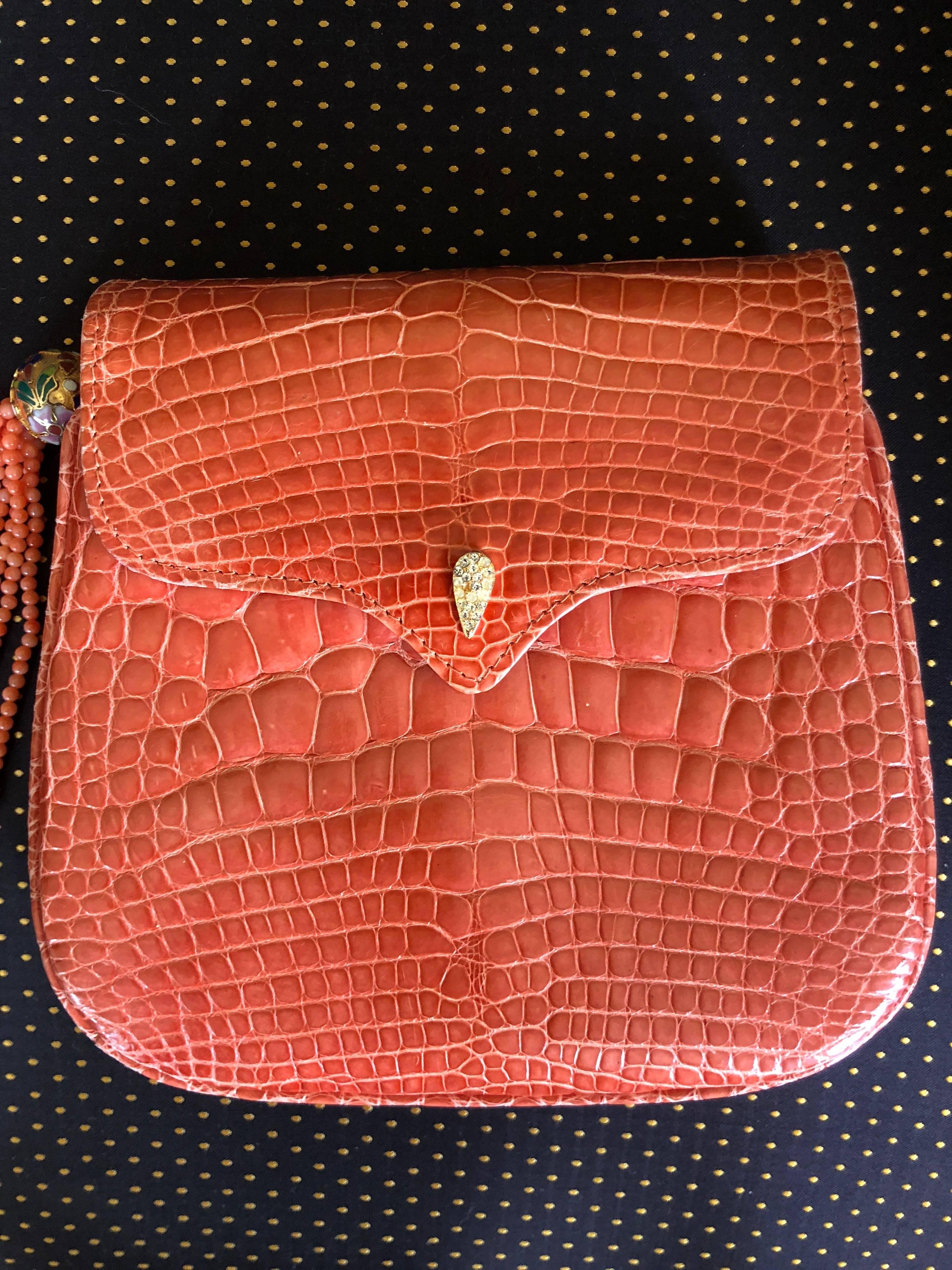 
Lana of London Exquisite Orange Crocodile Evening Bag with Coral Bead Strap and Tassel

 This is exquisite, but hard to photograph. 

7