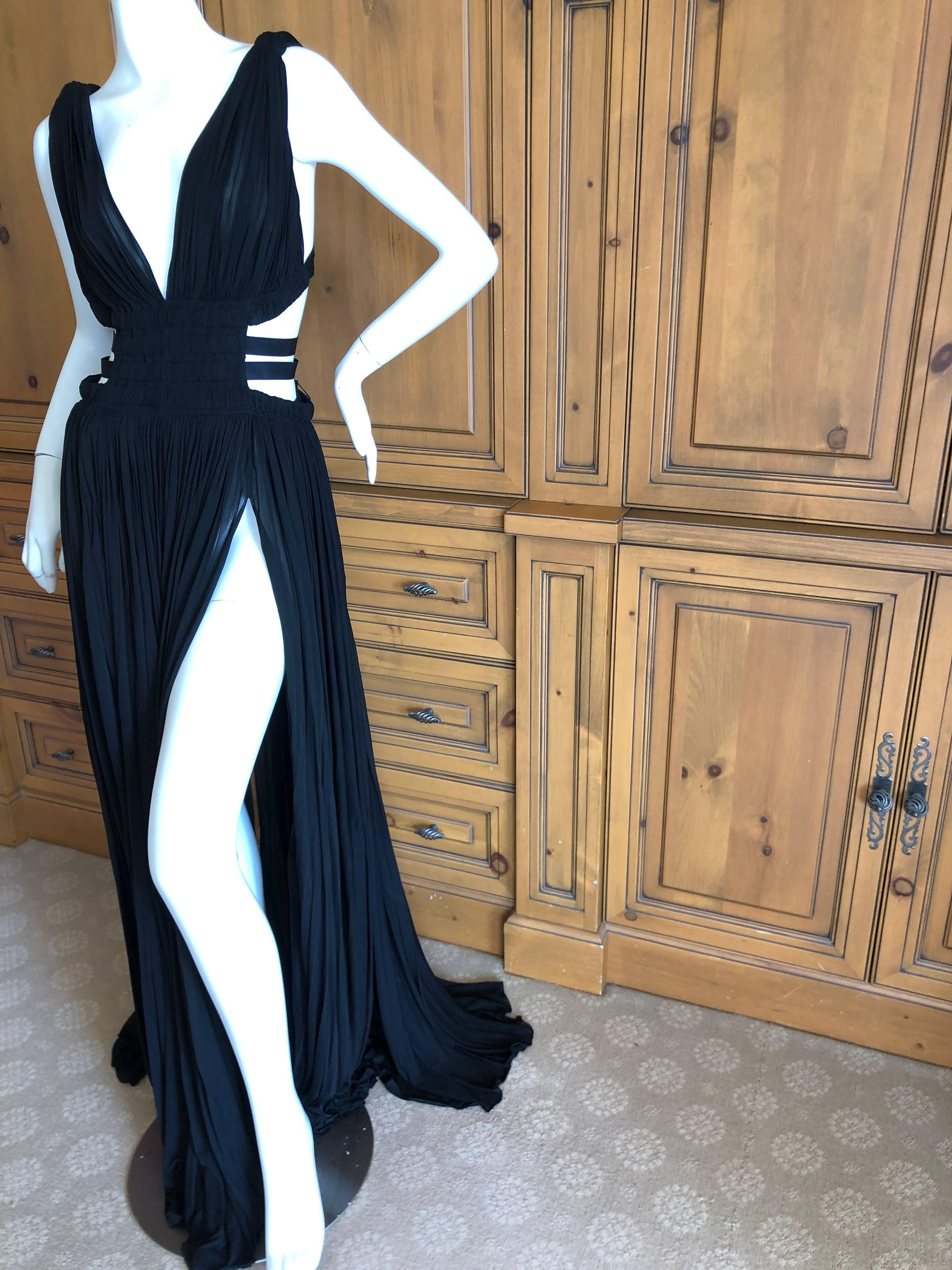Azzedine Alaia Vintage Autumn 1991 Black Pleated Goddess Gown with side straps
 Please see all the great vintage Alaia in my store.
This appears to never have been worn and is extremely long
 Size 40
 Bust 36
