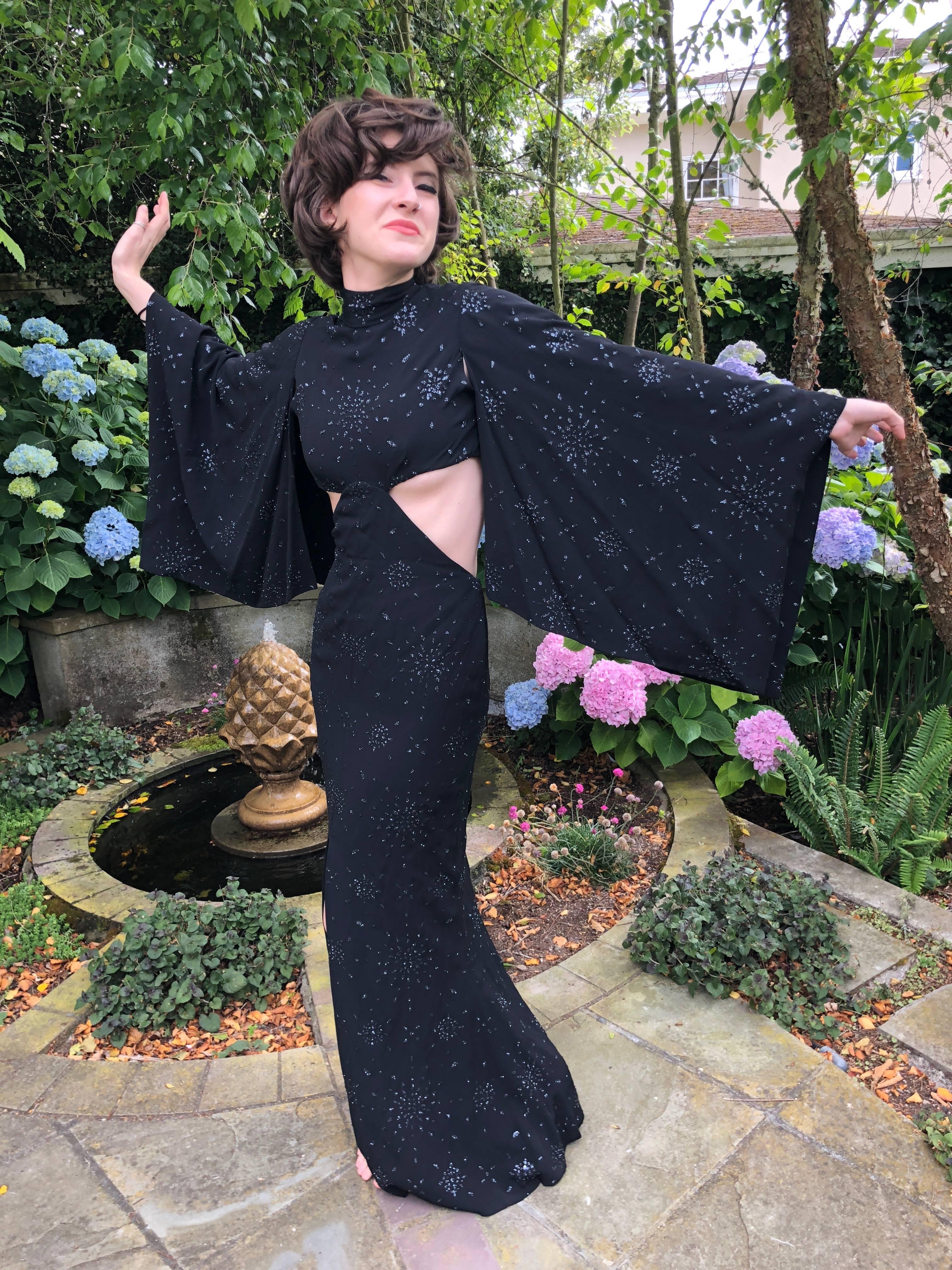 Cardinali 1970's Seductive Glittering Cut Out Evening Dress with Kimono Sleeves
From the Archive of Marilyn Lewis, the creator of Cardinali
Cardinali was founded in Los Angeles in 1970, by Marilyn Lewis, who had already found success as the founder