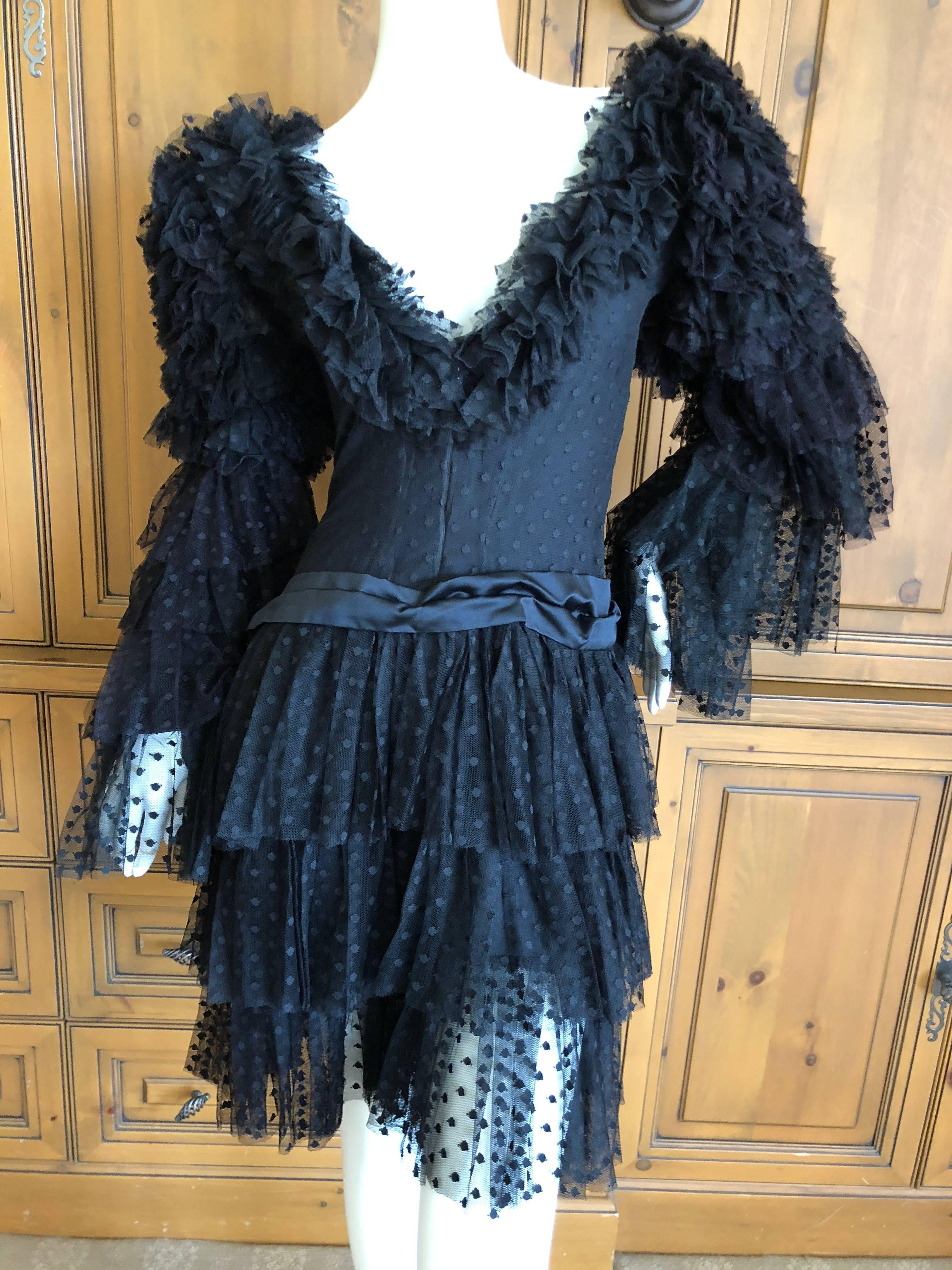 Cardinali Dramatic Black Ruffled Poet Sleeve Silk Cocktail Dress.
I haven't a clue which is the front or back, I show it both ways.

From the Archive of Marilyn Lewis, the creator of Cardinali
Cardinali was founded in Los Angeles in 1970, by Marilyn