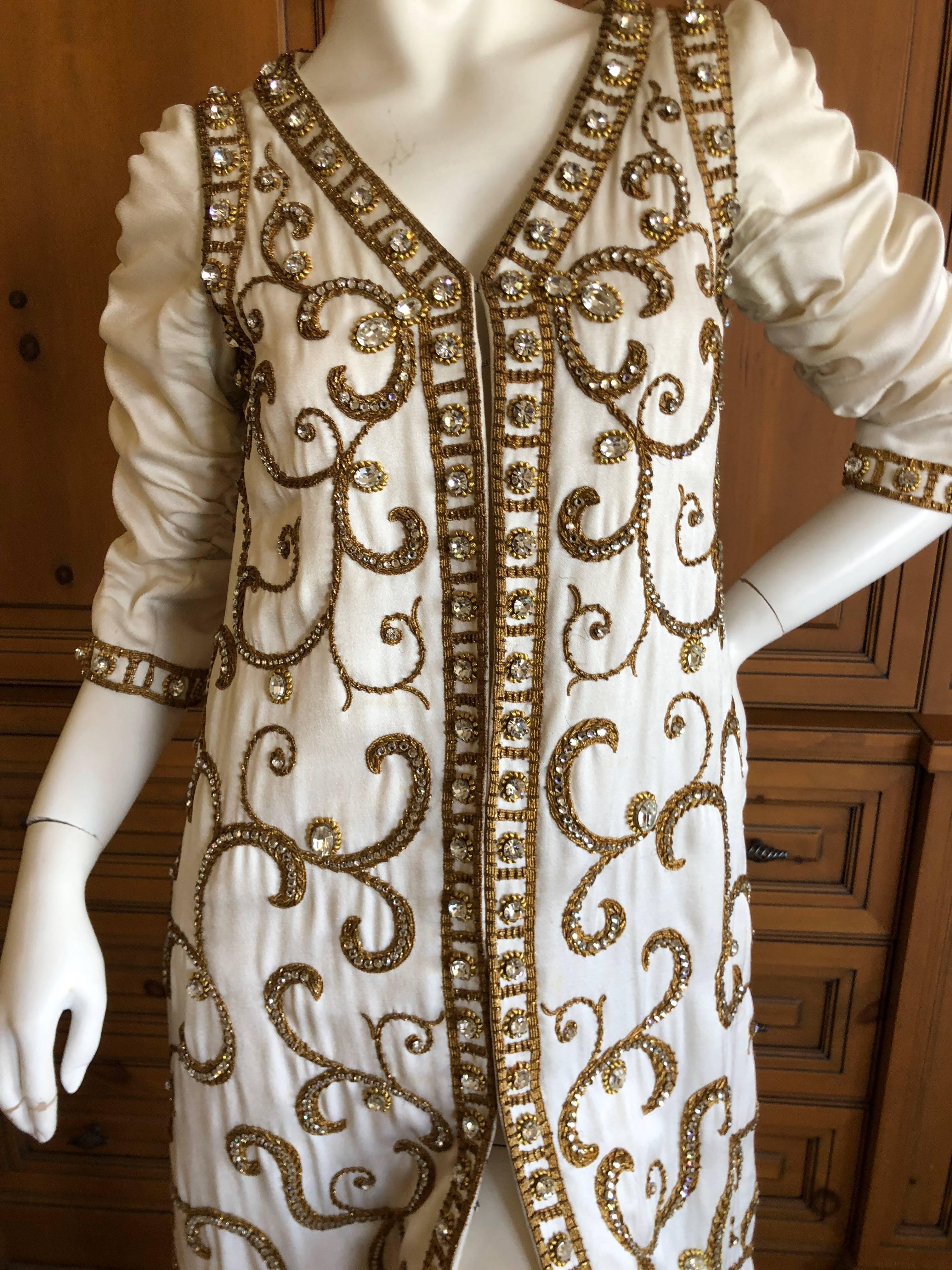 Cardinali Showstopping 1970 Arabesque Crystal Embellished Evening Coat Dress.
Ivory silk evening coat richly embellished with an arabesque pattern in goldwork embroidery and  crystals.
Please use the zoom feature to see all the details, it is quite