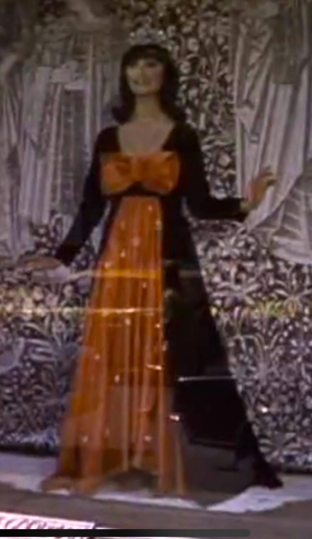 Cardinali Orange Silk Crystal Trim Babydoll Gown with Matching Black Velvet Coat.
This dress was featured in the That Girl opening credits when Ann Marie see's herself wearing this gown with a tiara in the windows of Bergdorf Goodman.
From the