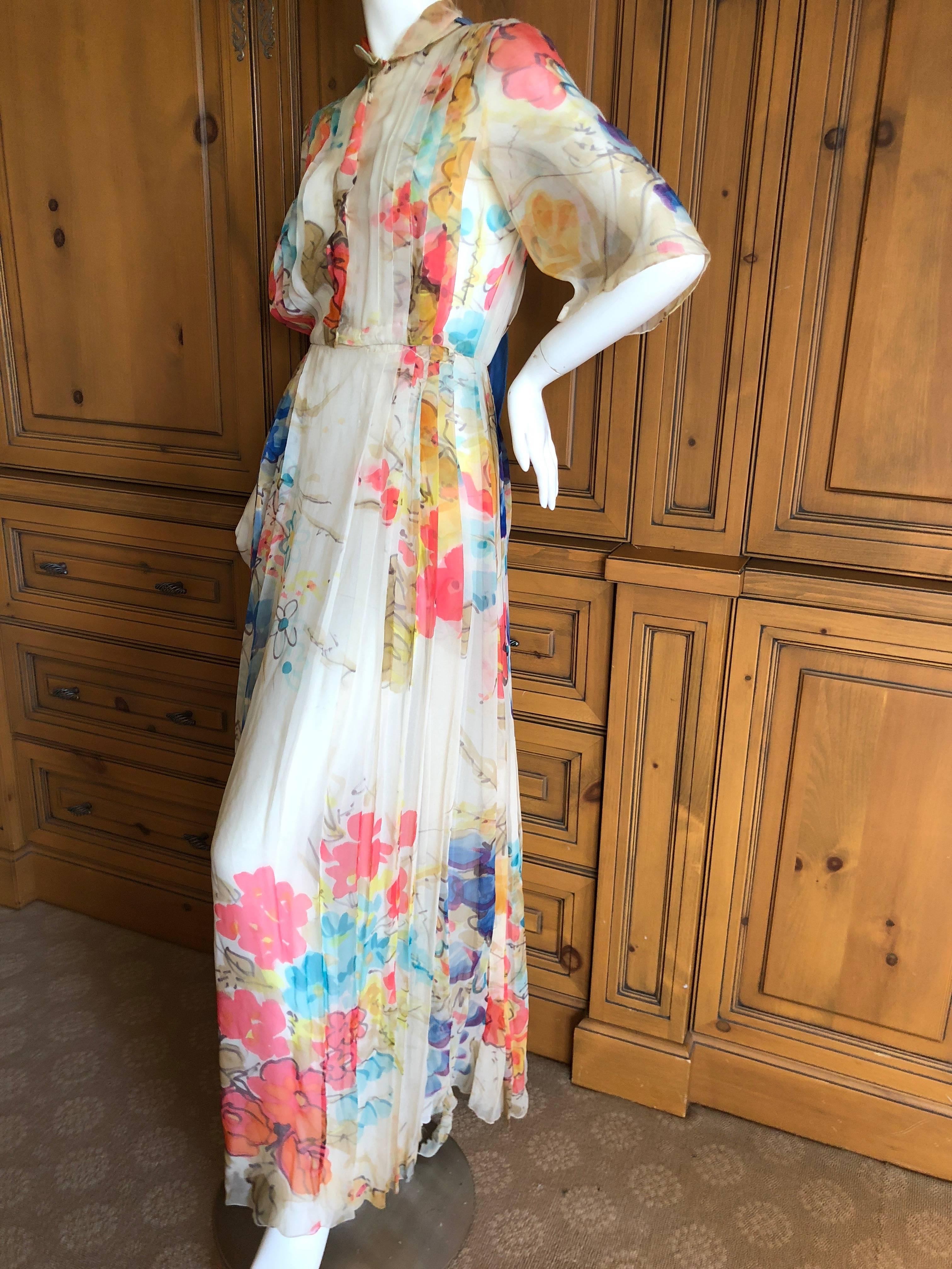 Cardinali Elegant Pleated Ivory Floral Silk Short Sleeve Evening Dress.

From the Archive of Marilyn Lewis, the creator of Cardinali
Cardinali was founded in Los Angeles in 1970, by Marilyn Lewis, who had already found success as the founder and