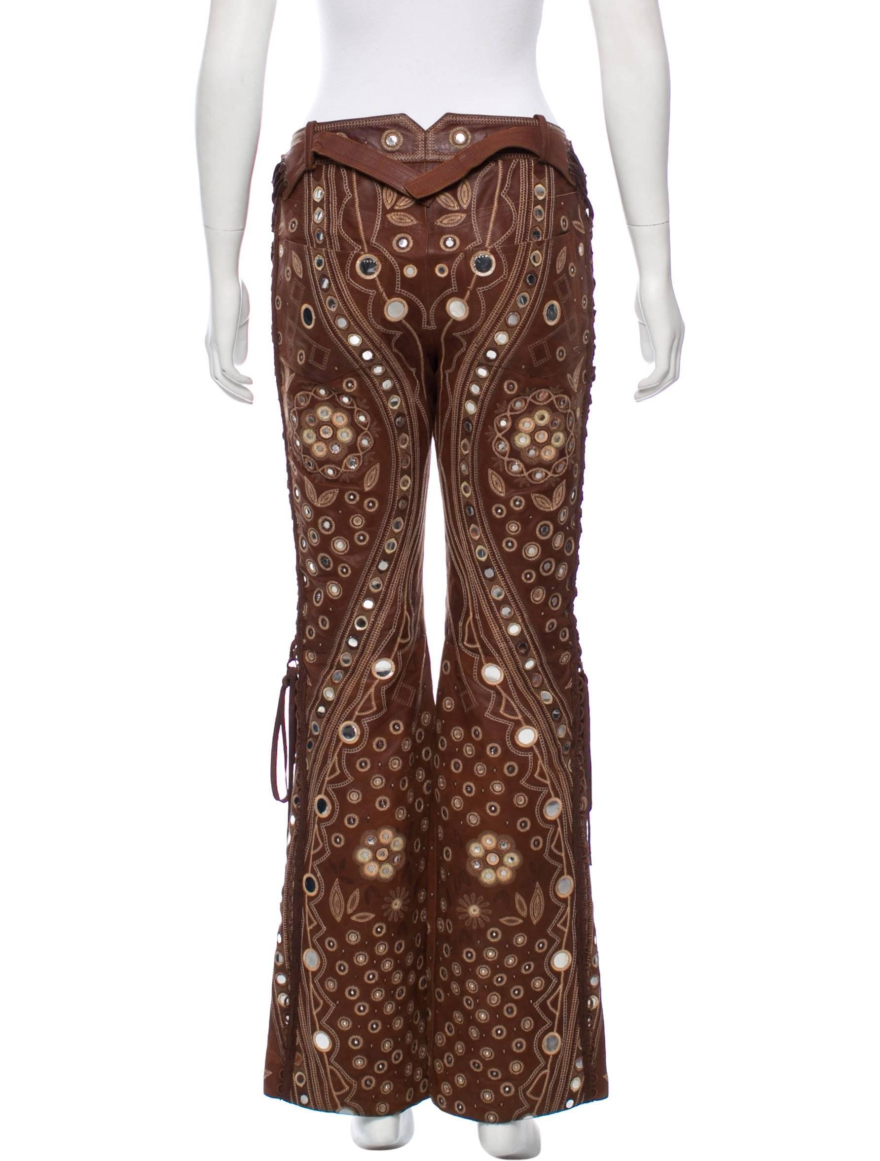  Amazing embellished brown leather pants by Christian Dior by John Galliano 
Lined in silk , two side pockets.


 Size 36

 Waist 28