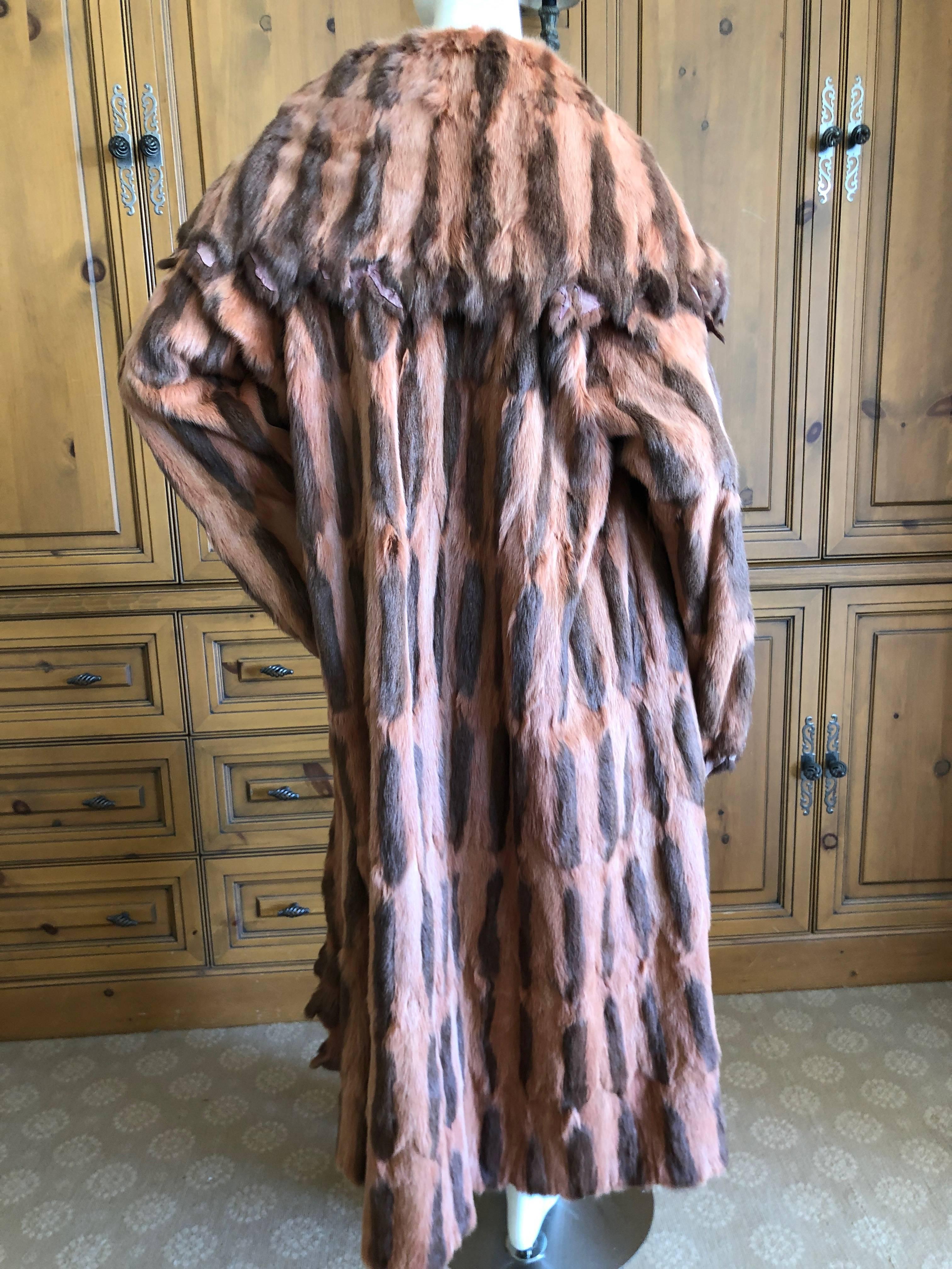 Fendi by Karl Lagerfeld Bonwit Teller 1980 Sawtooth Edge Floor Sweeping Fur Coat
Wonderful styling, it's like a cocoon , cape, but with long sleeves.
The fur is two tone, I am not certain what type, either squirrel or ermine?

Because of the