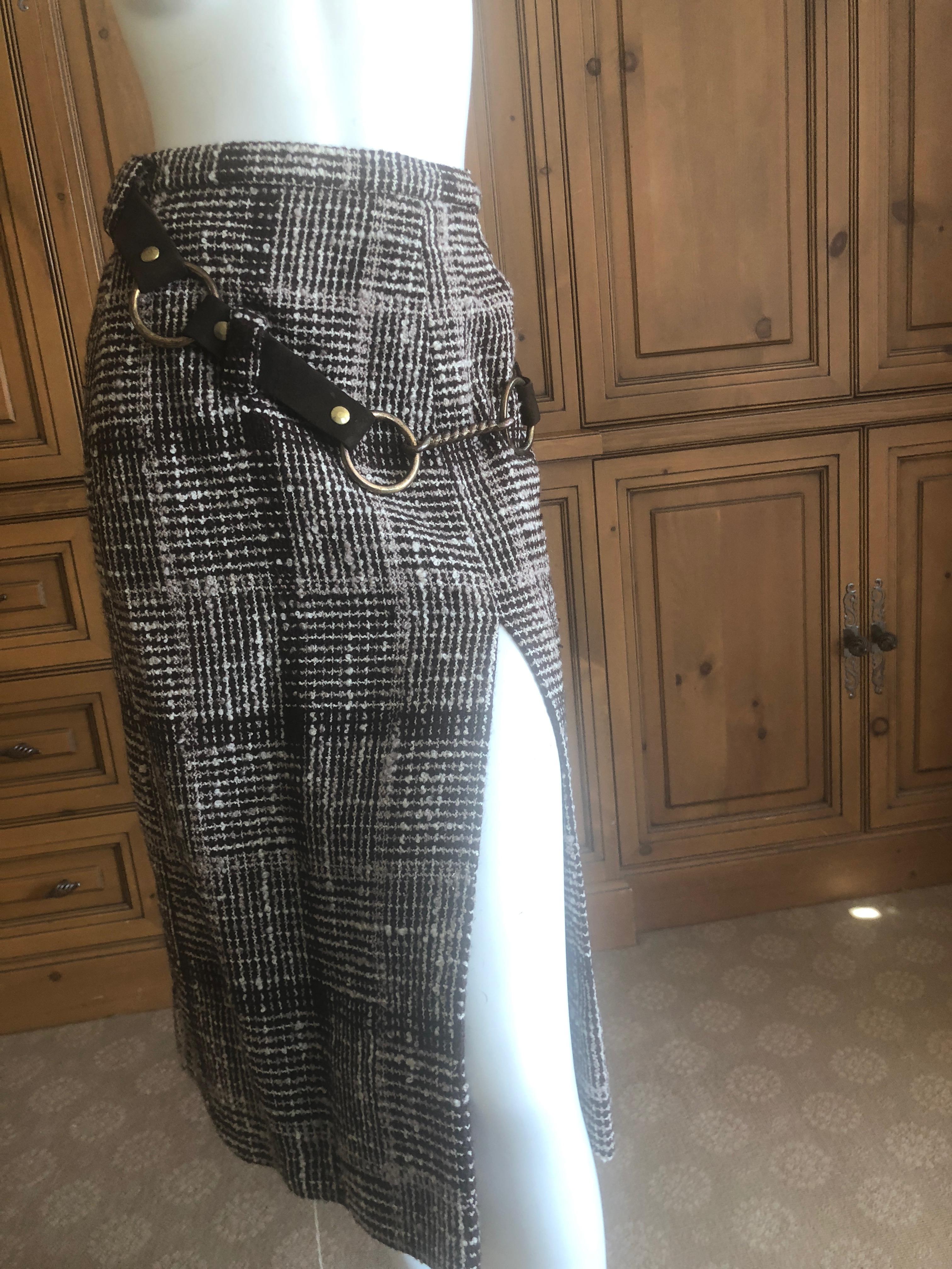Cardinali Plaid Tweed Skirt with Brass Hardware and Leather Belt Straps

From the Archive of Marilyn Lewis, the creator of Cardinali
Cardinali was founded in Los Angeles in 1970, by Marilyn Lewis, who had already found success as the founder and