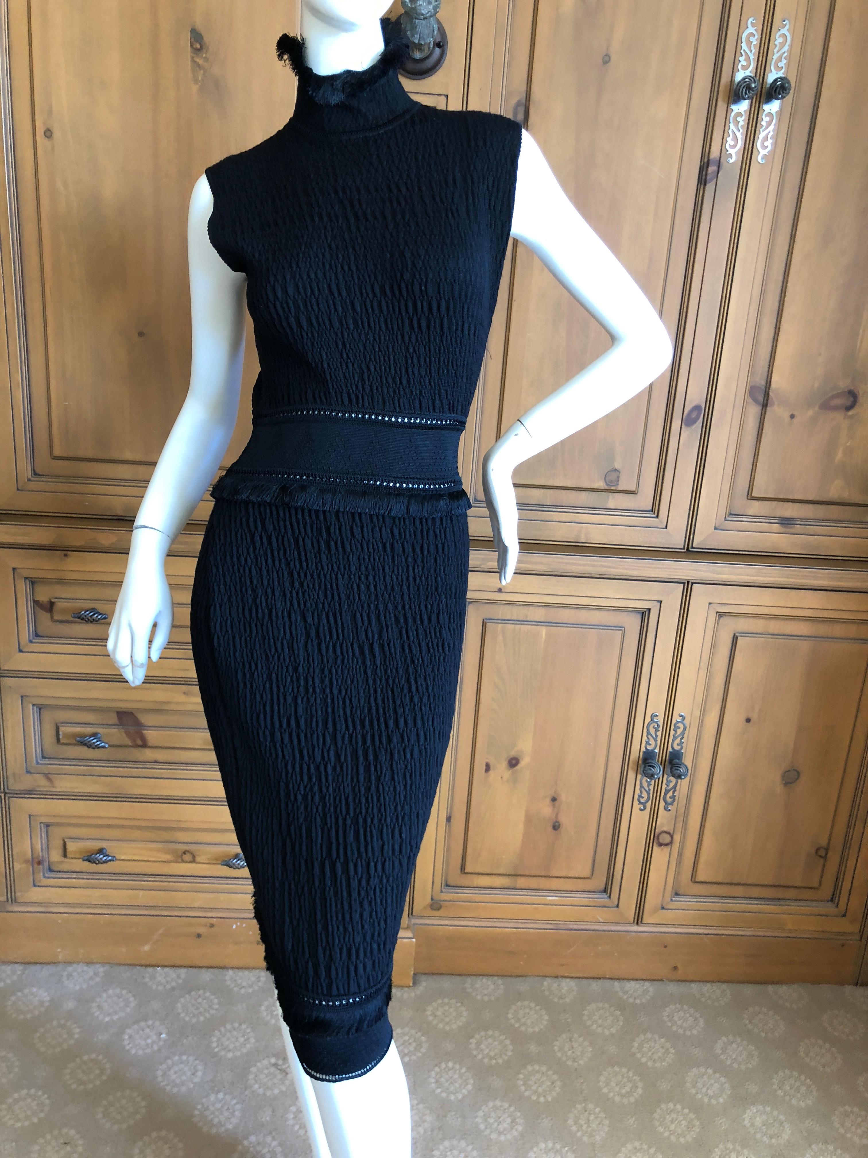 John Galliano 1990's Black Fringed Dress with Matching Wide Mink Collar Sweater .
Early cloth label Galliano, featuring a lovely sleeveless dress with a matching cardigan sweater with a wide mink collar.
Wear together or separately.

Sweater
Bust:
