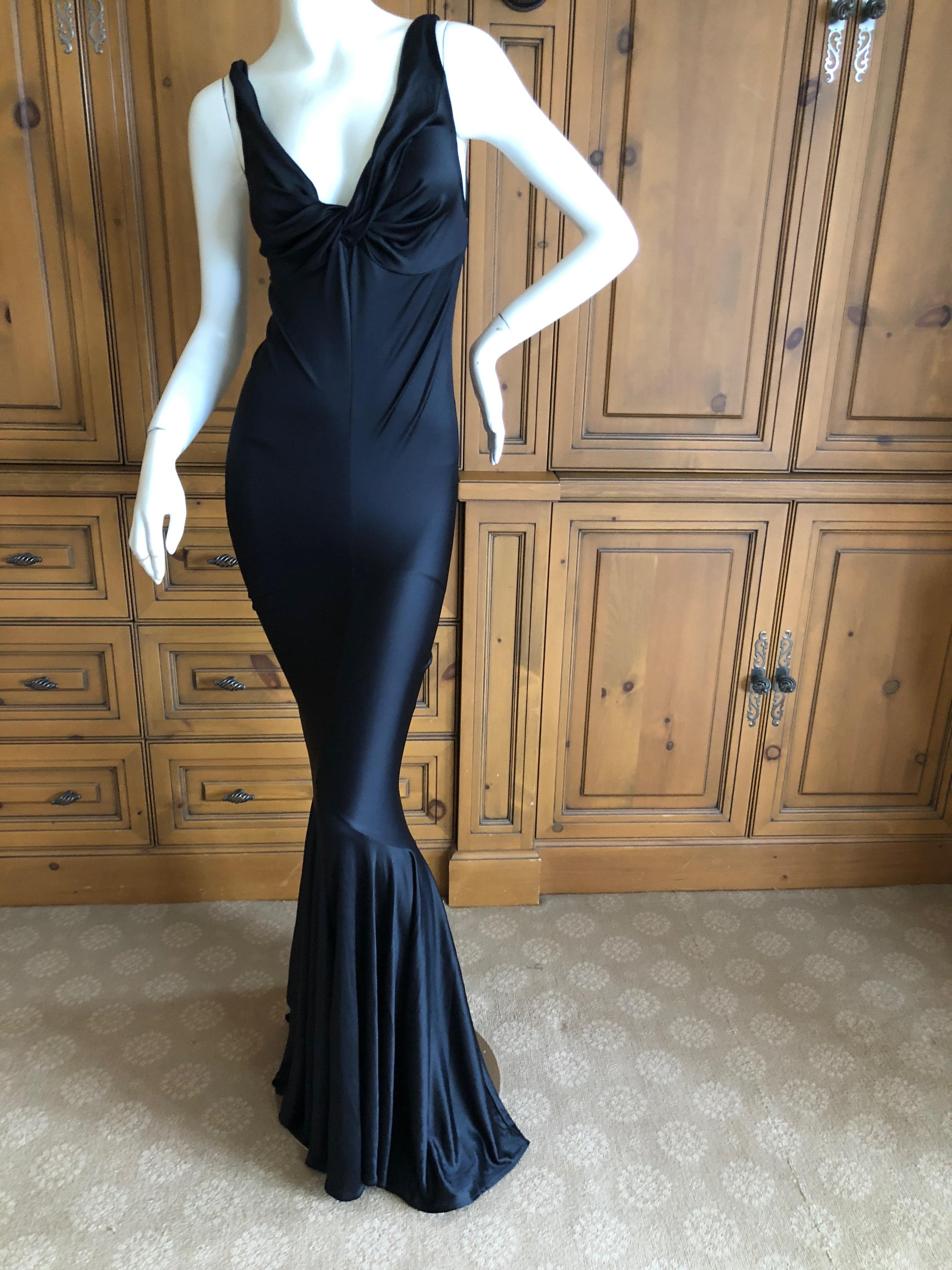 
Exquisite long black evening dress from early label John Galliano.
Size L
Bust 36