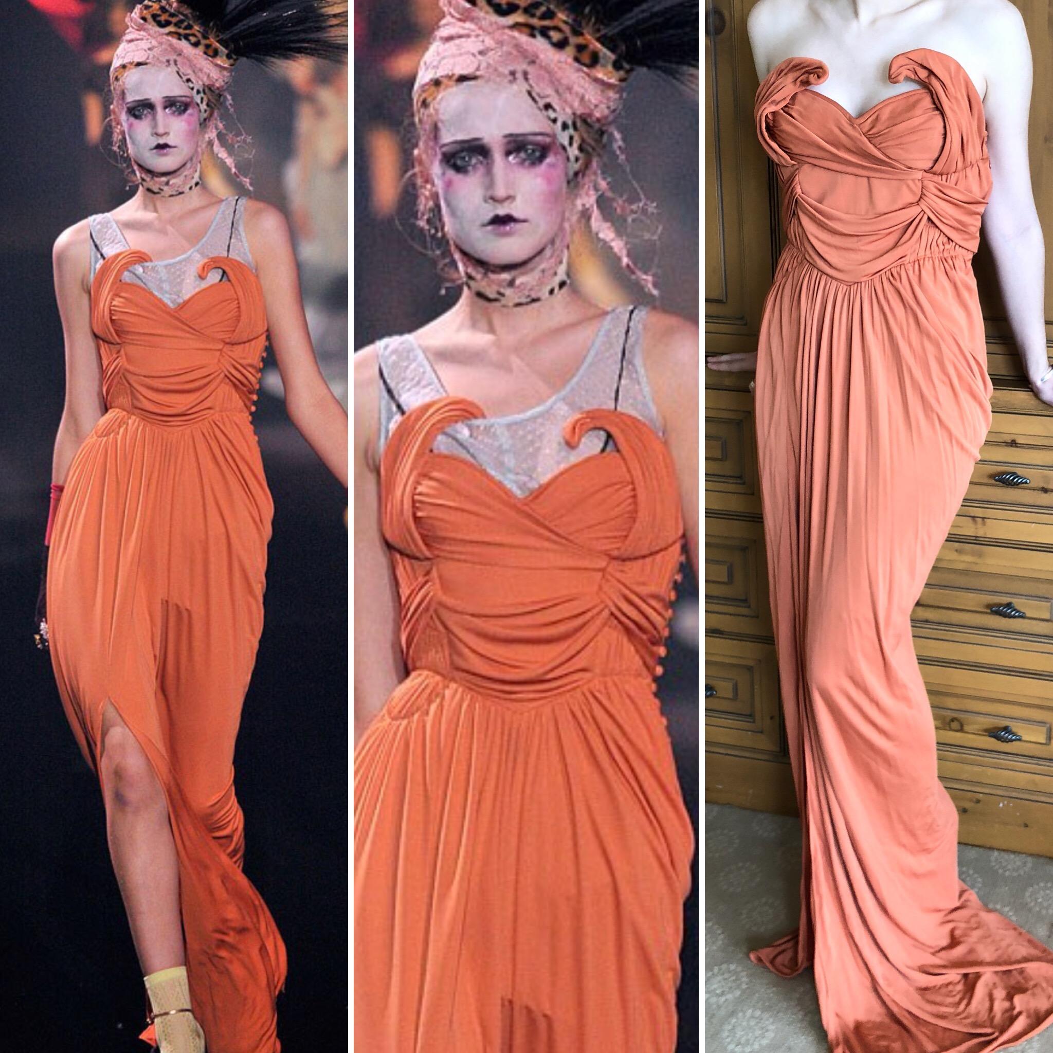 
Exquisite long orange evening dress from Spring 2010 by John Galliano.
Using 1920's Hollywood as a starting point for the collection, Galliano channels 20's Hollywood red carpet glamour.
Inner corset.
There is no size or fabric label.
Bust 36