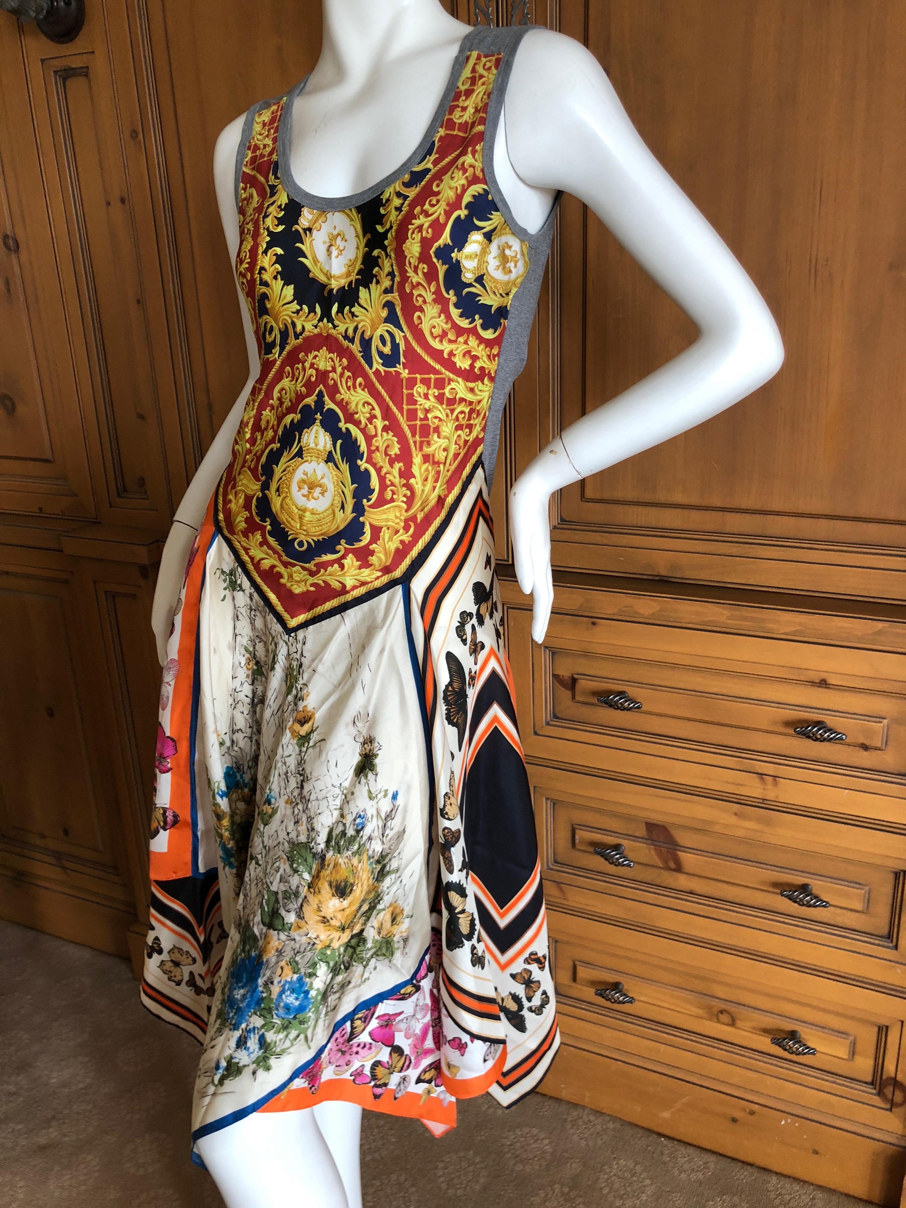 Dolce & Gabbana for D&G Vintage Silk Dress with Butterfly Print Handkerchief Hem
  There is  a lot of stretch
Sie 40
Bust 36