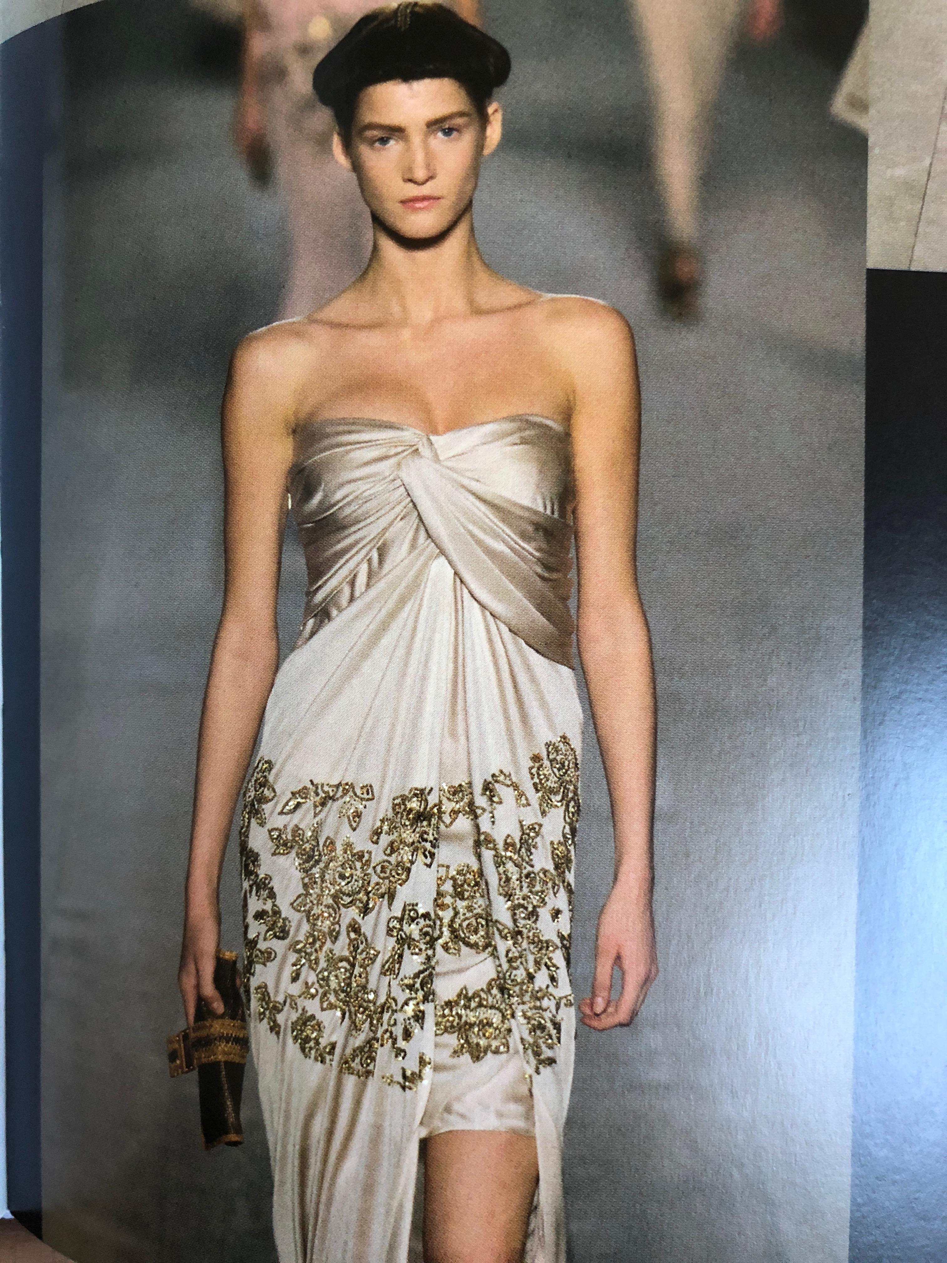  Christian Dior by John Galliano Evening Dress with Gold Sequin Floral Details 
So pretty ,there is a high slit, with a short skirt that shows when revealed.
Size 38
 Bust 34