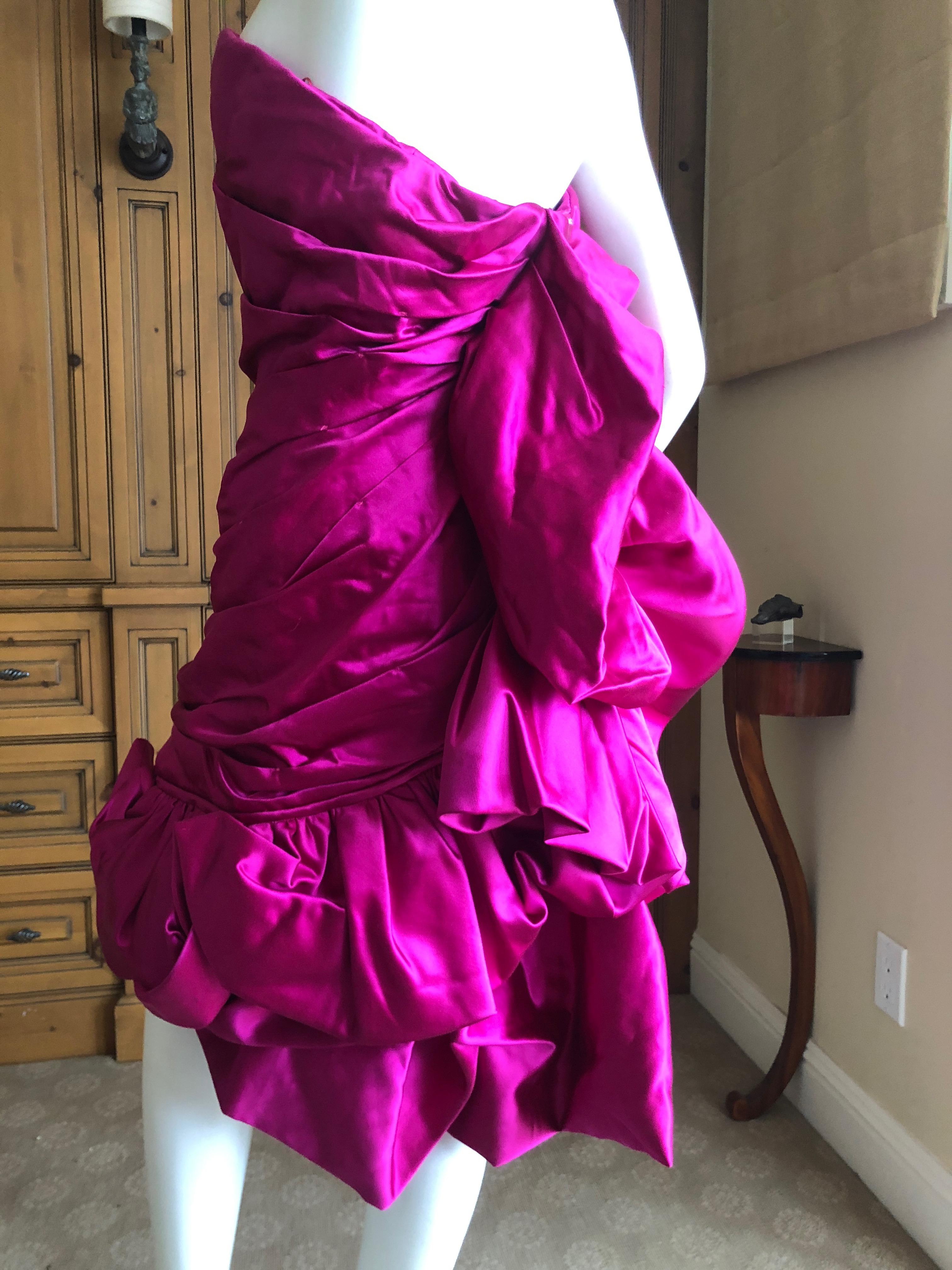 Christian Lacroix Vintage 1980's Raspberry Silk Corseted Pouf Dress New w Tags
This is so pretty, but is a little heavy, there is a lot of fabric for such a little dress
Size 40
Bust 36