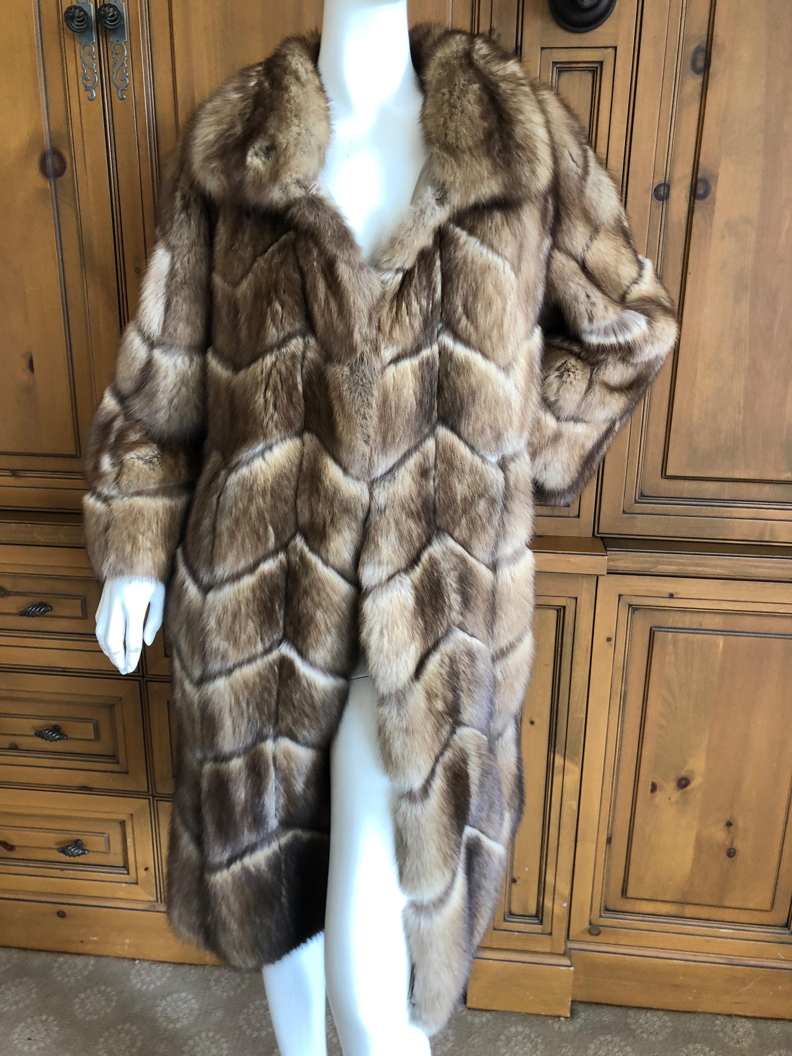 J. Mendel Golden Sable Chevron Pattern Fur Coat from Neiman Marcus.
Lined in silk , this is very lightweight
The pelts are luxurious and soft. there are no shoulder pads.

Four large fur closure hook into rings to keep it closed.


Bust 40