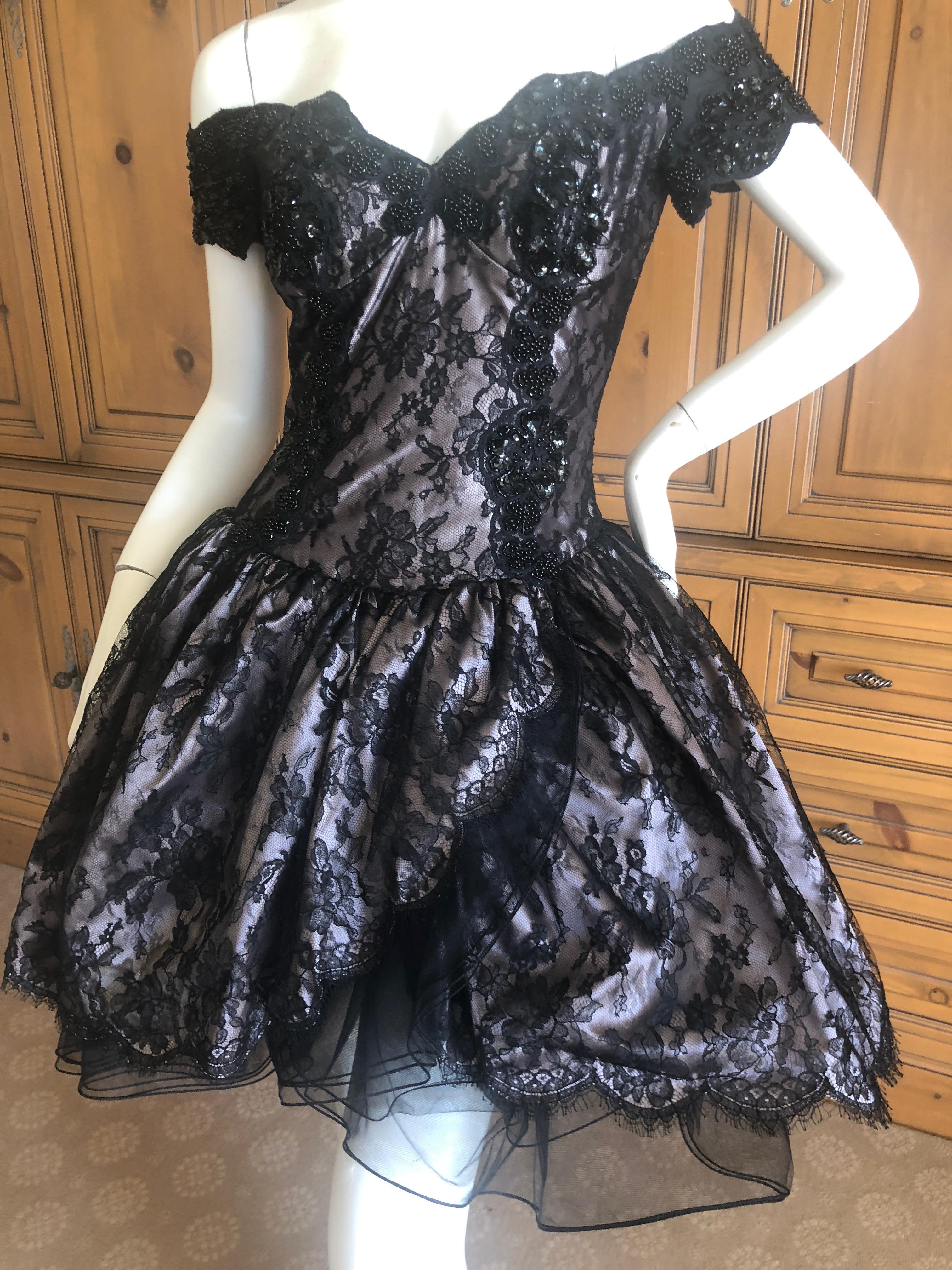 Vicky Teil Couture Paris Bergdorf Goodman 1982 Beaded Black Mini Pouf Ball Dress.
This has a built in inner corset  and zips up the back.
Please use the zoom feature to see the details.
Size 38
Bust 36